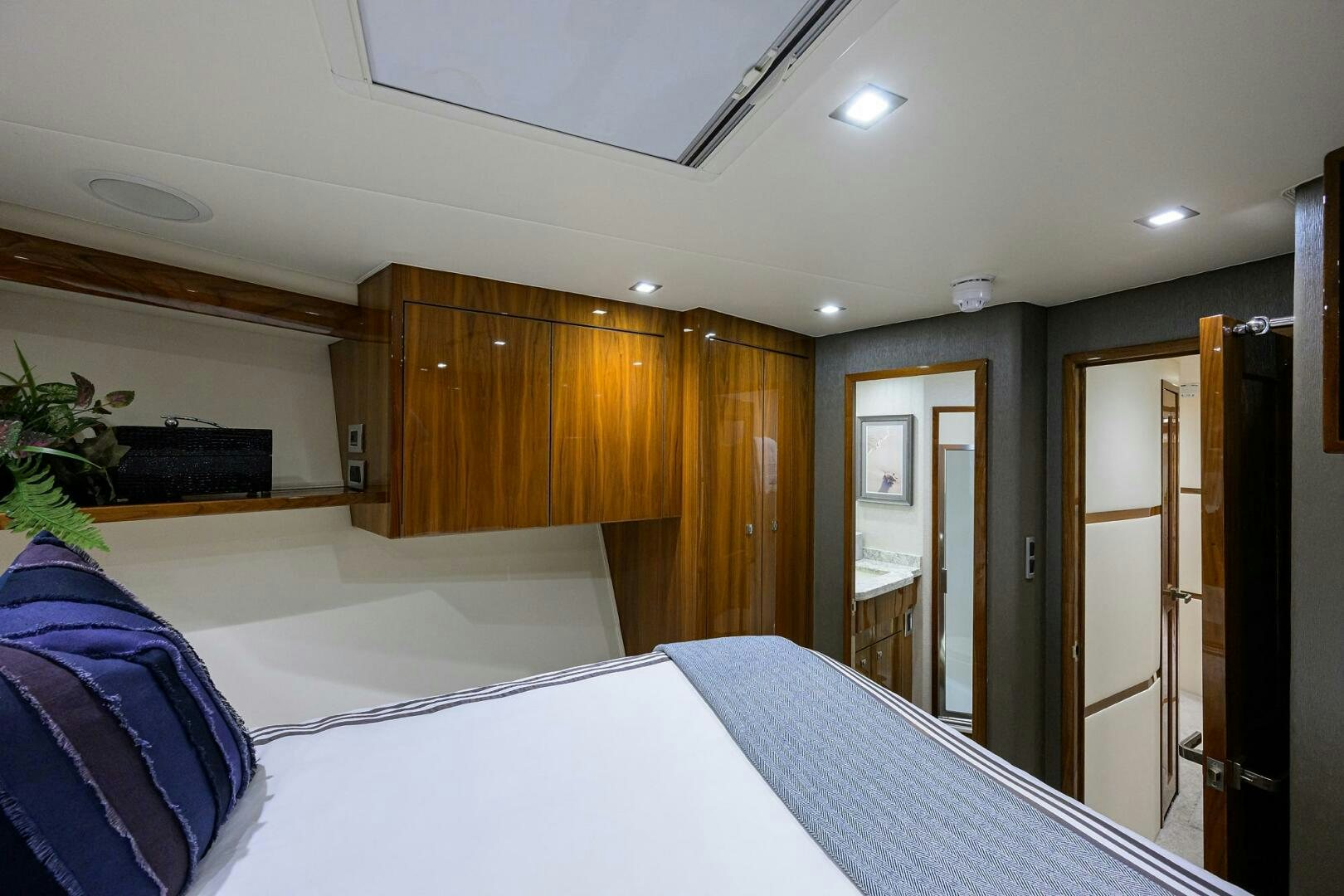 a room with a bed and a closet aboard BACCHUS Yacht for Sale