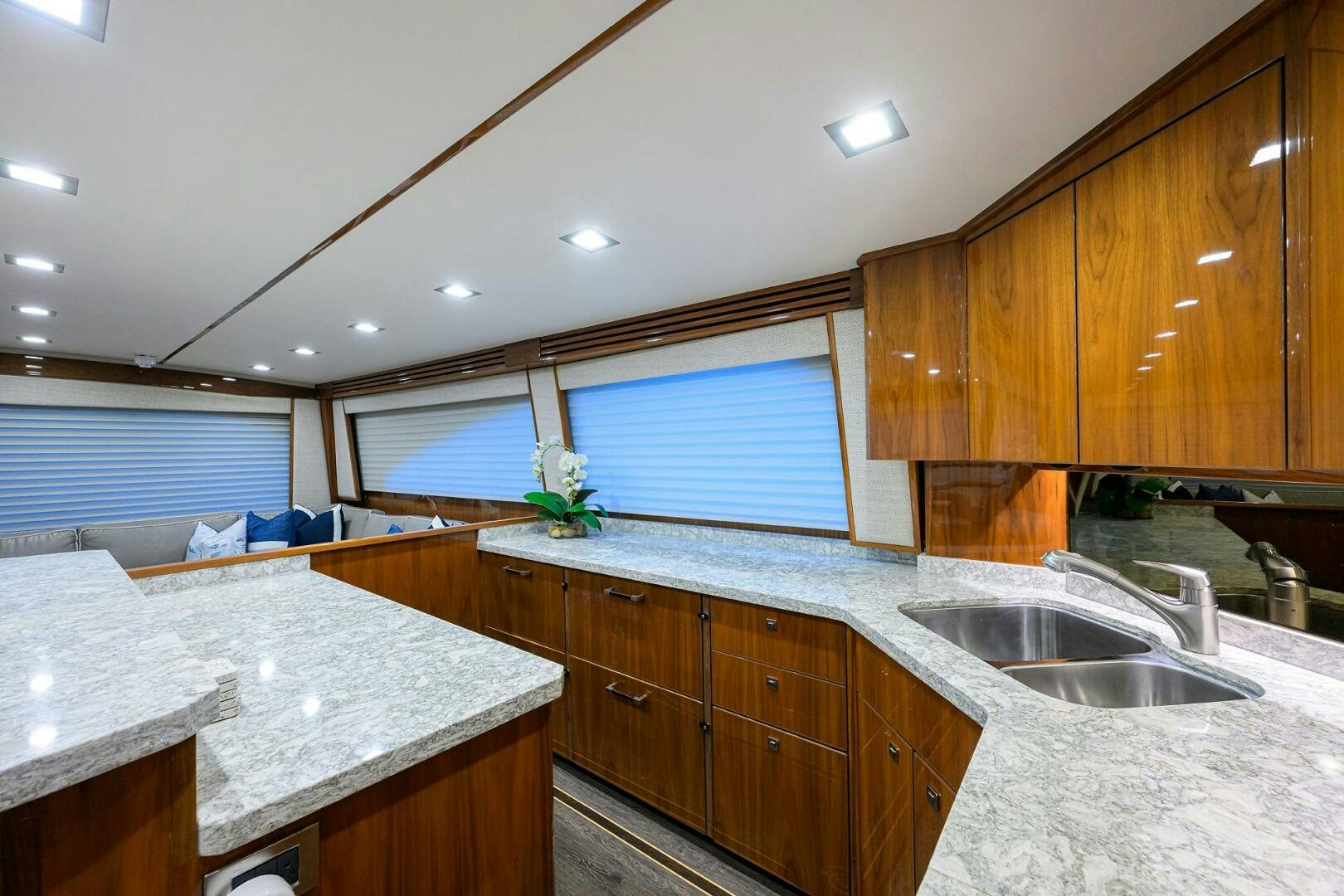 a kitchen with wooden cabinets aboard BACCHUS Yacht for Sale