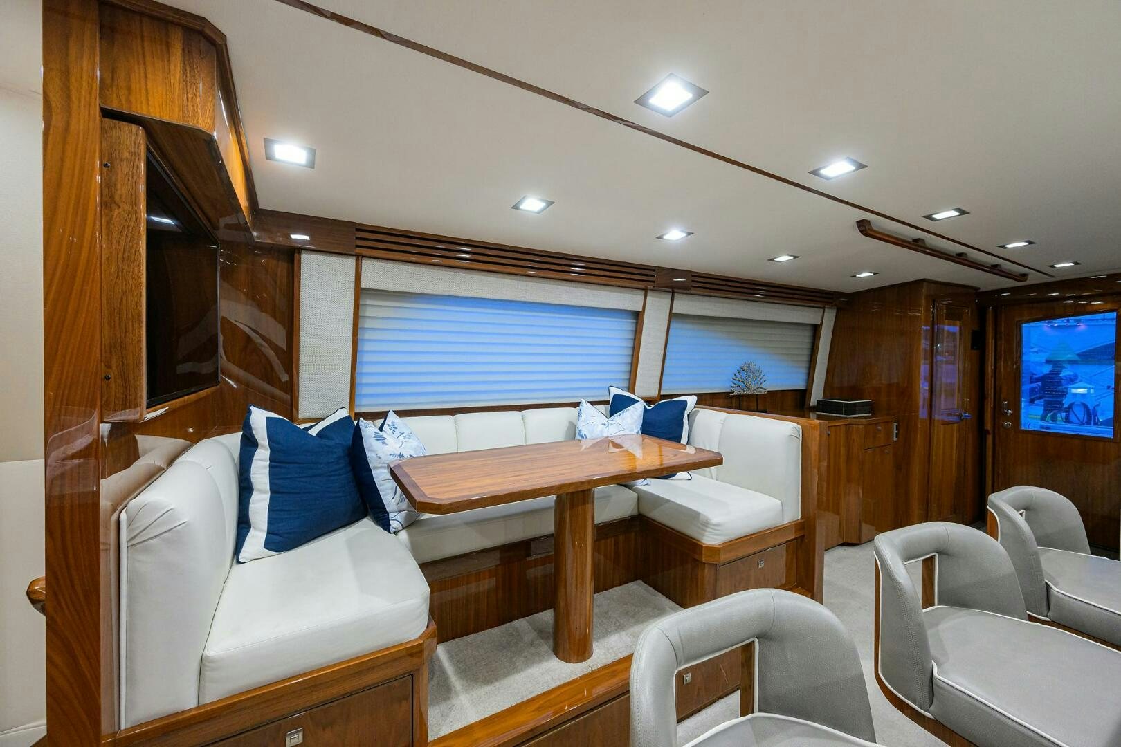 a room with a table and chairs aboard BACCHUS Yacht for Sale