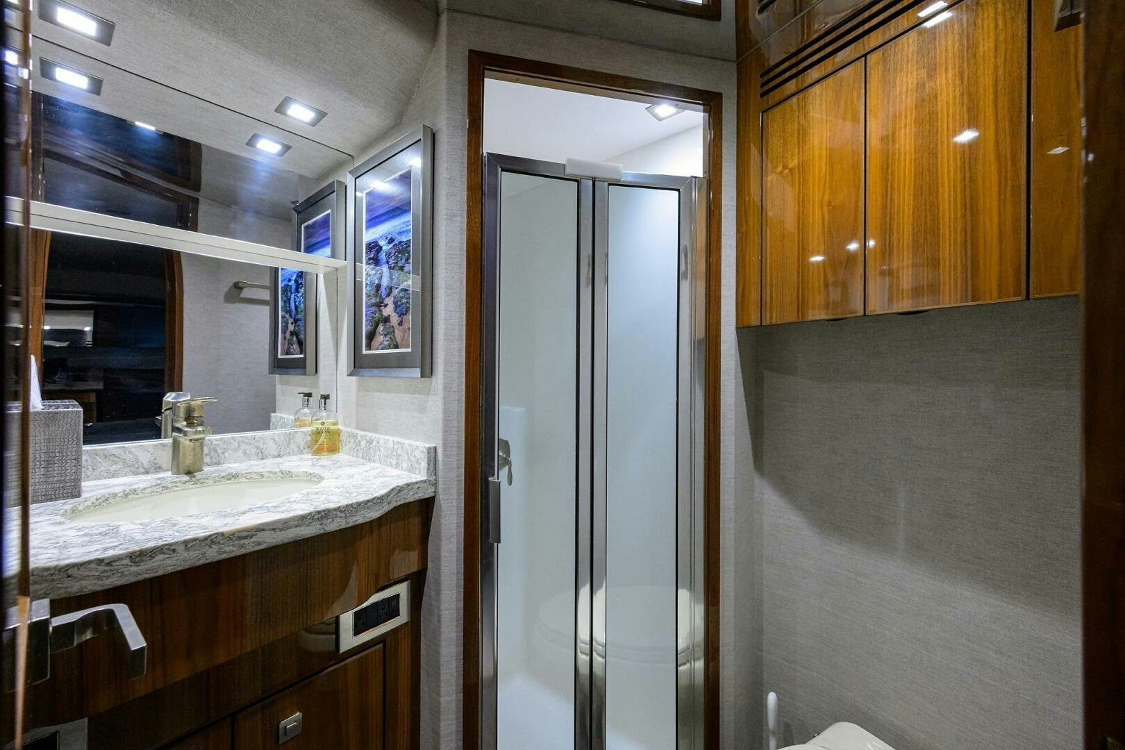 a bathroom with a glass shower aboard BACCHUS Yacht for Sale