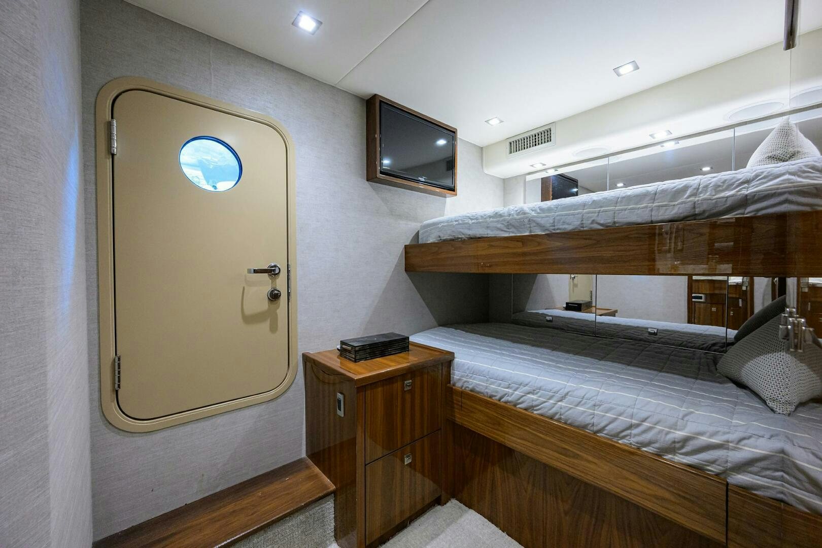 a room with a bed and a tv aboard BACCHUS Yacht for Sale