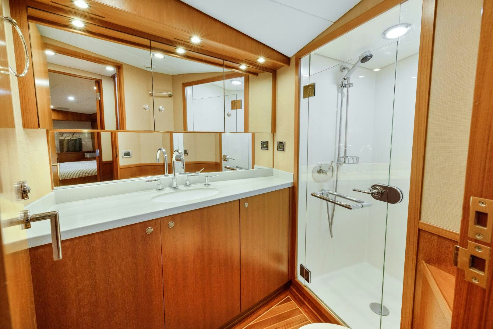 a bathroom with a glass shower aboard SALTY K Yacht for Sale