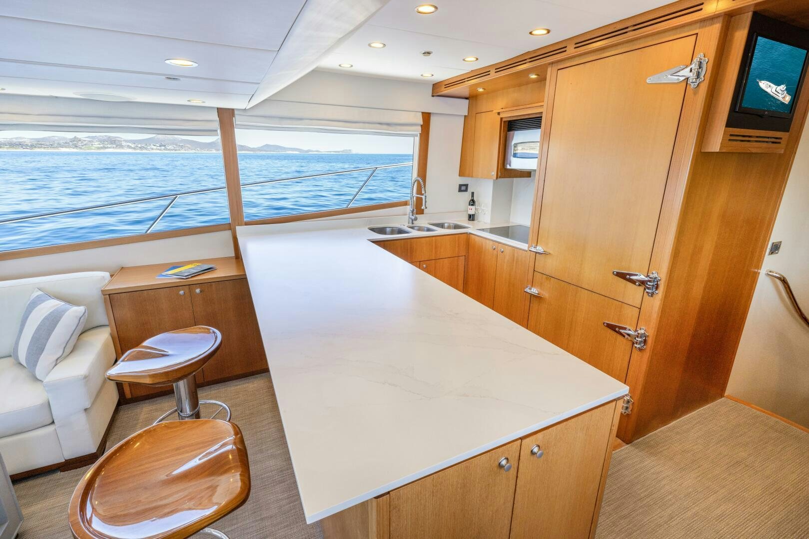 a kitchen with a large island aboard SALTY K Yacht for Sale