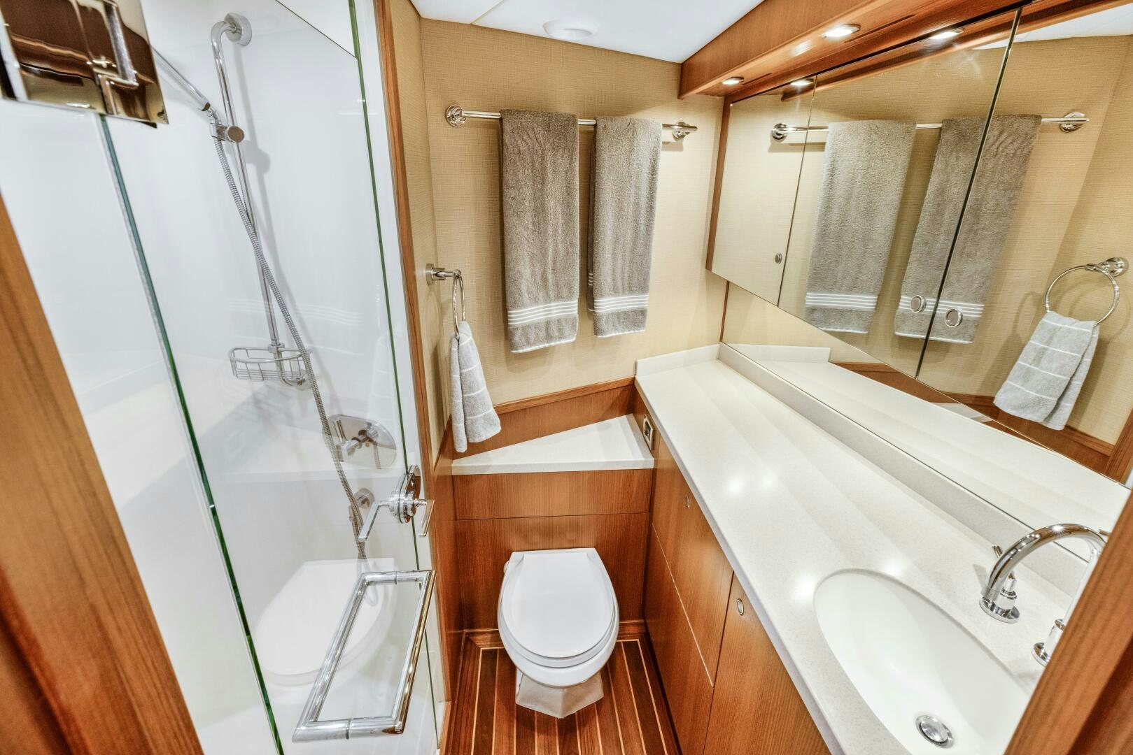 a bathroom with a glass shower aboard SALTY K Yacht for Sale