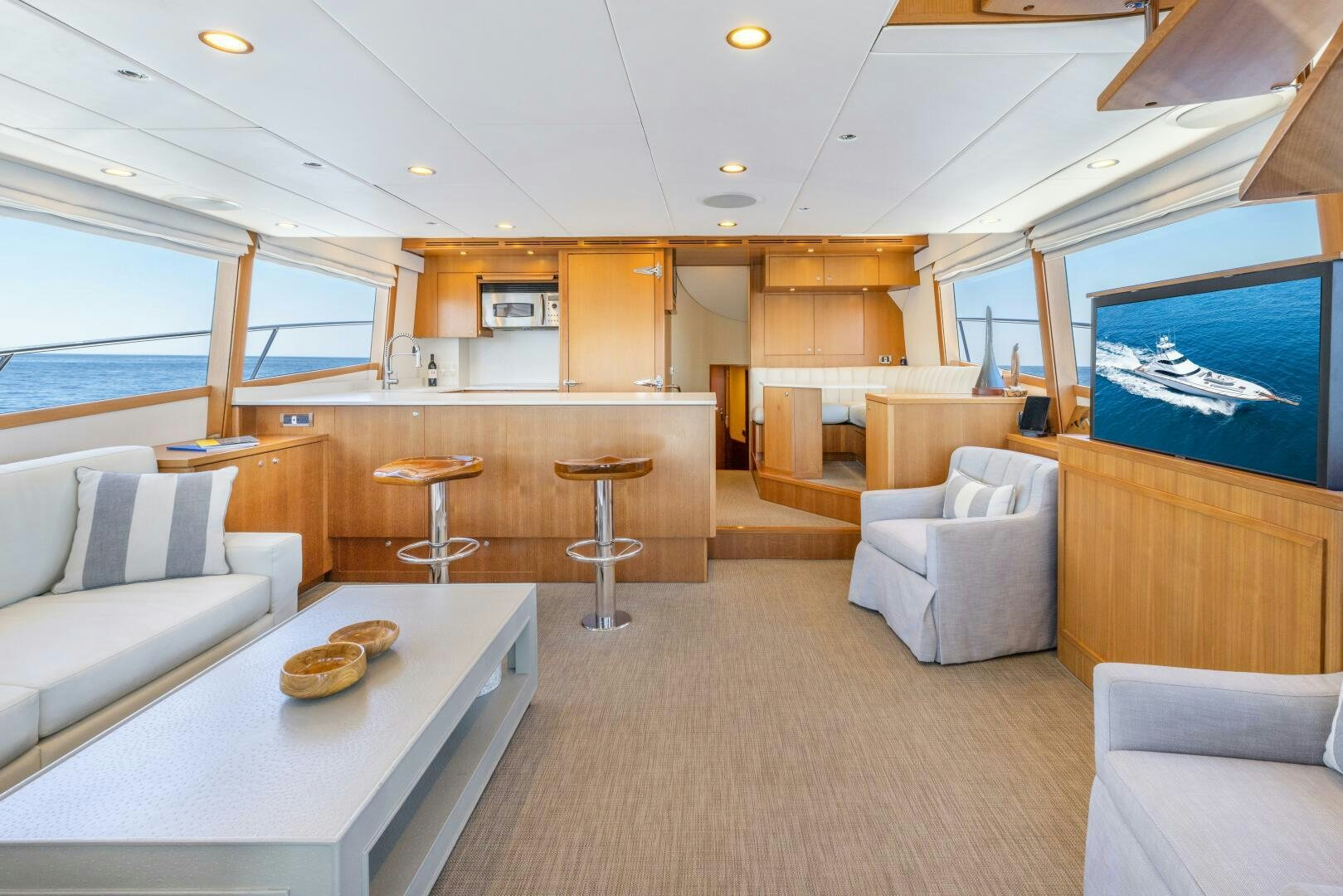 a room with a couch and a table aboard SALTY K Yacht for Sale
