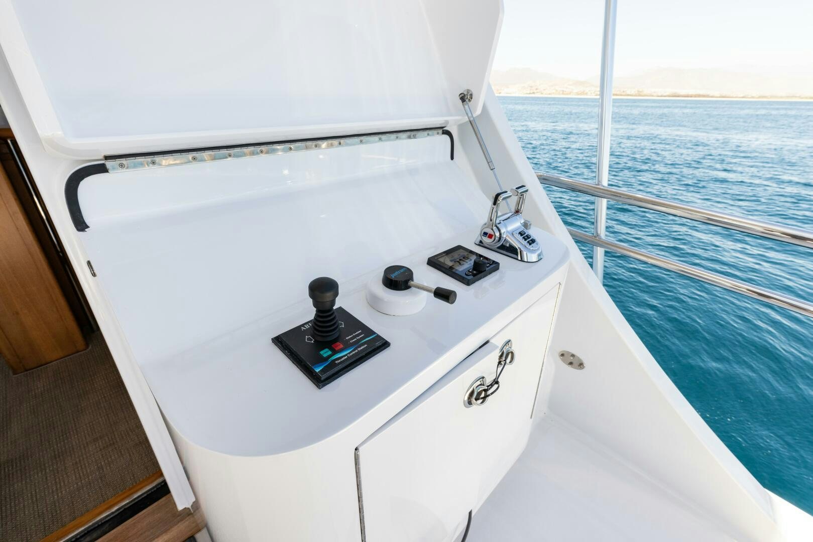 a white boat with a black device on it aboard SALTY K Yacht for Sale