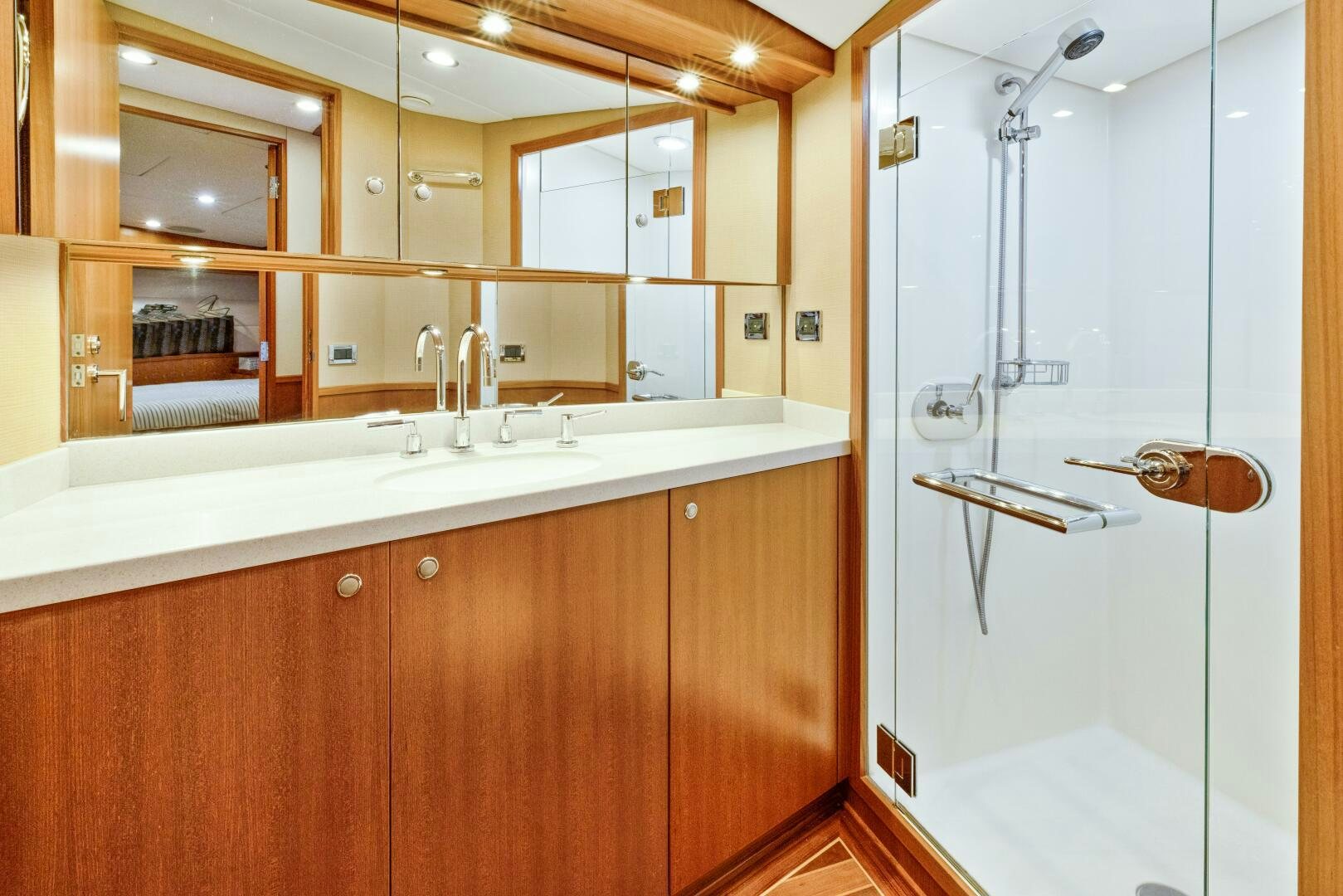 a bathroom with a glass shower door aboard SALTY K Yacht for Sale