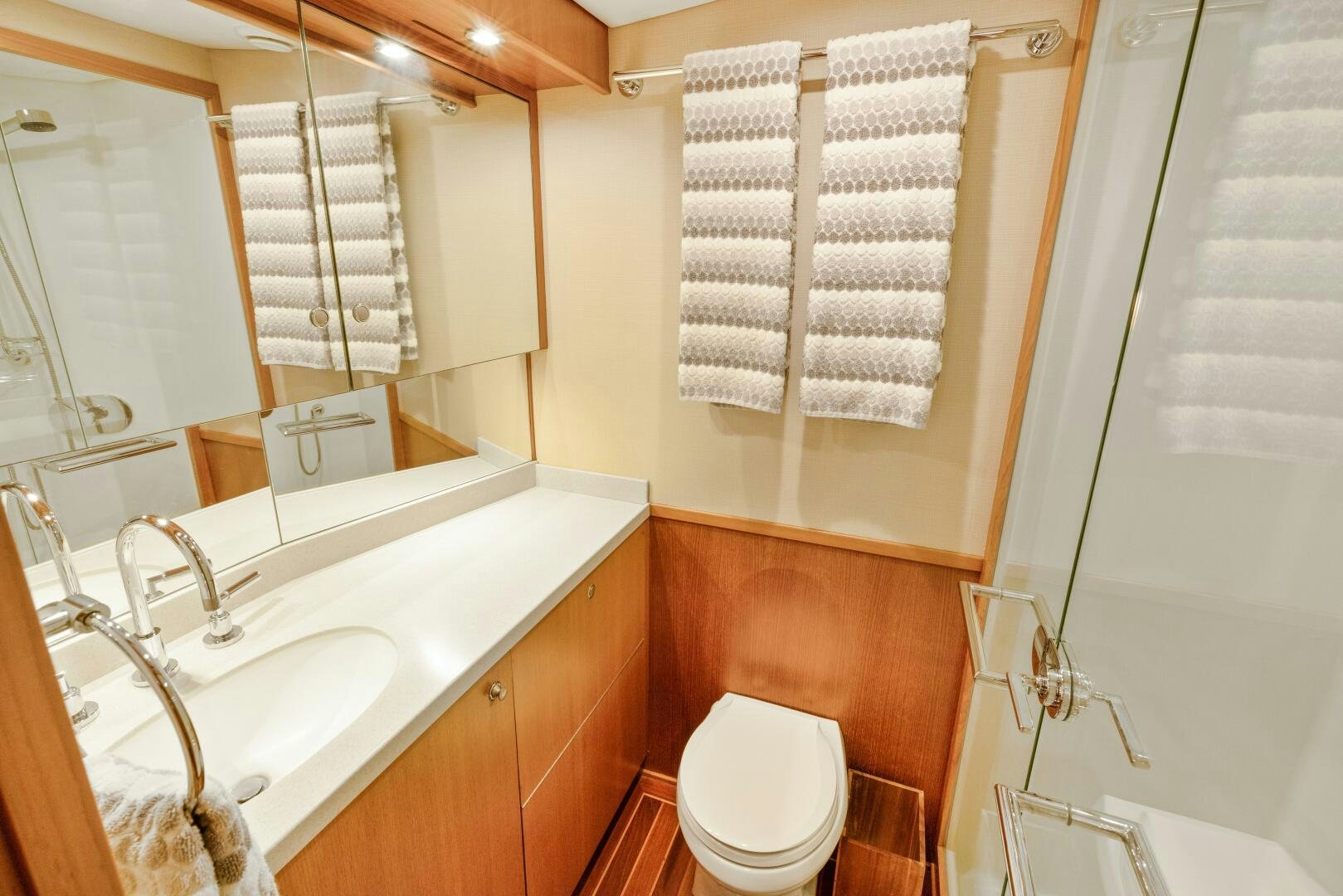 a bathroom with a toilet sink and a bathtub aboard SALTY K Yacht for Sale