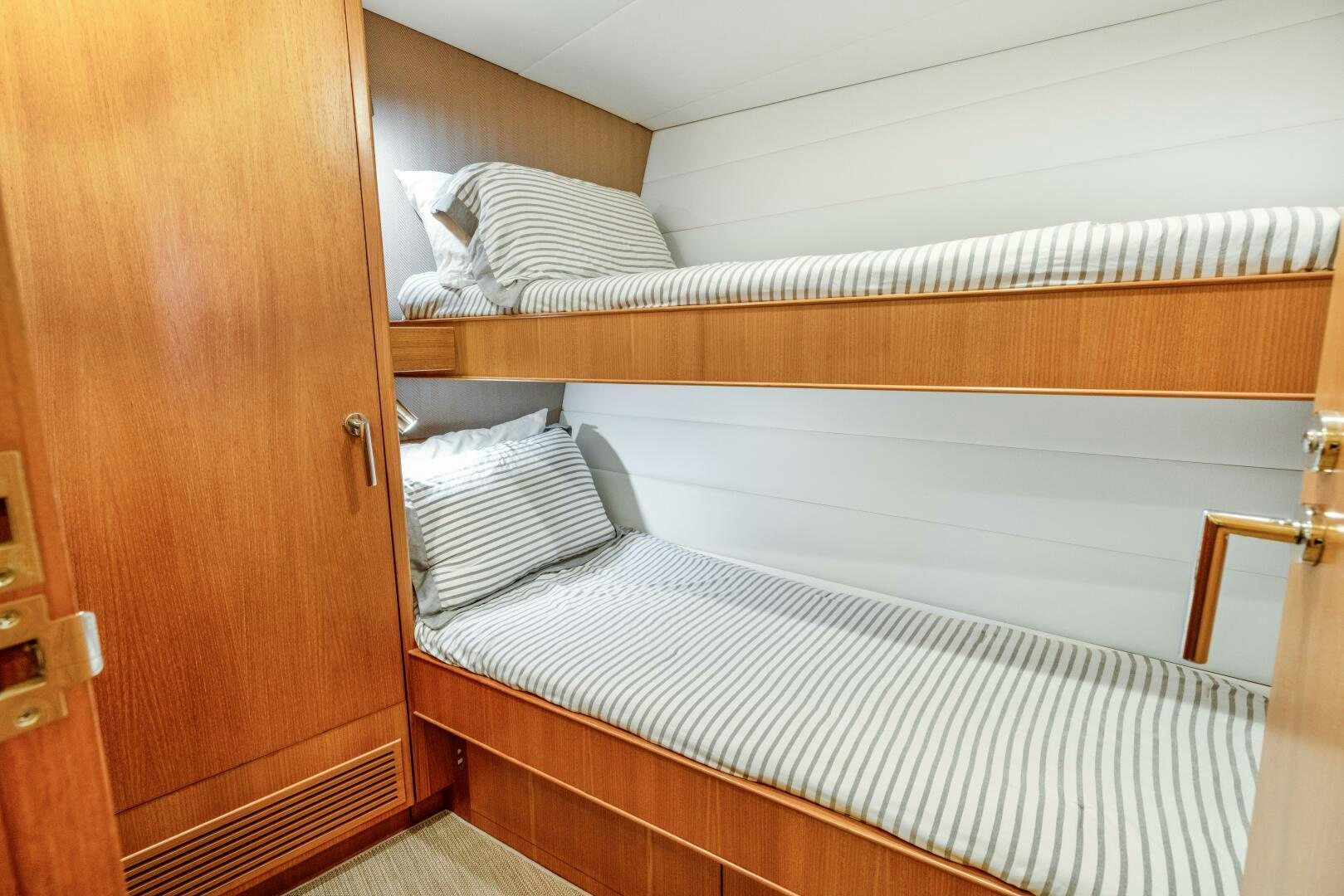 a bed with white sheets aboard SALTY K Yacht for Sale
