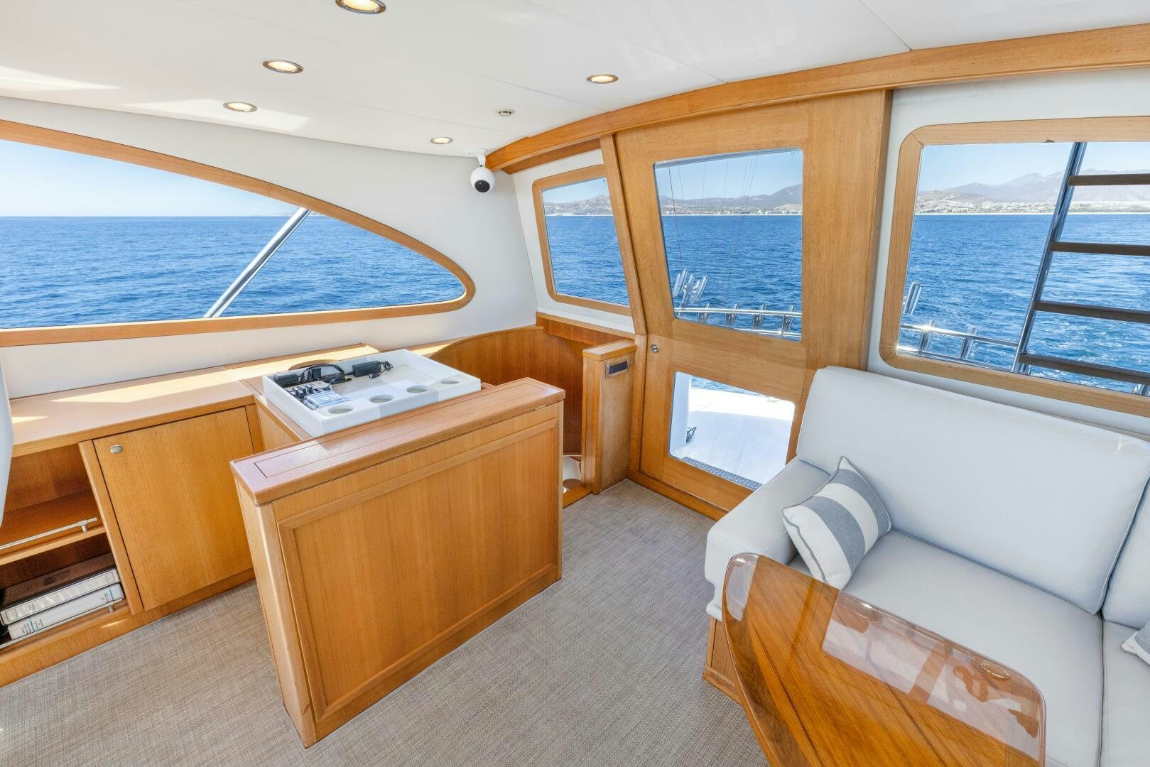 a room with a couch and a table and a bed aboard SALTY K Yacht for Sale