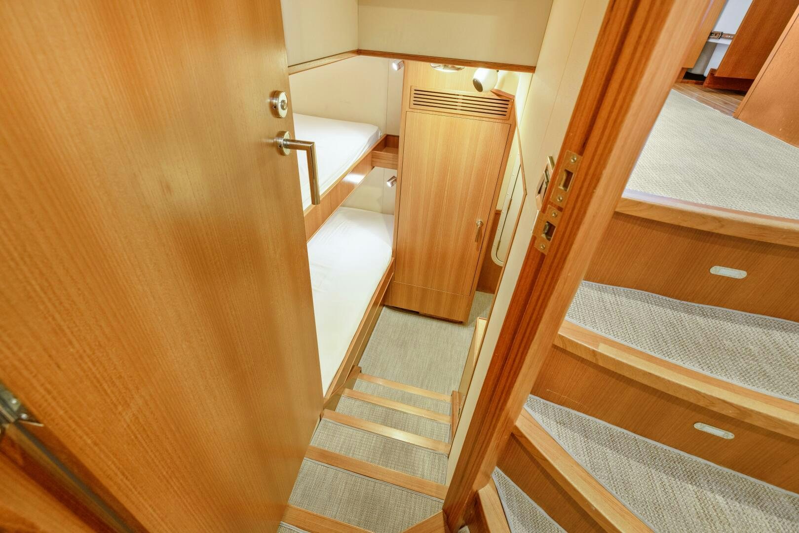 a hallway with a wood door aboard SALTY K Yacht for Sale