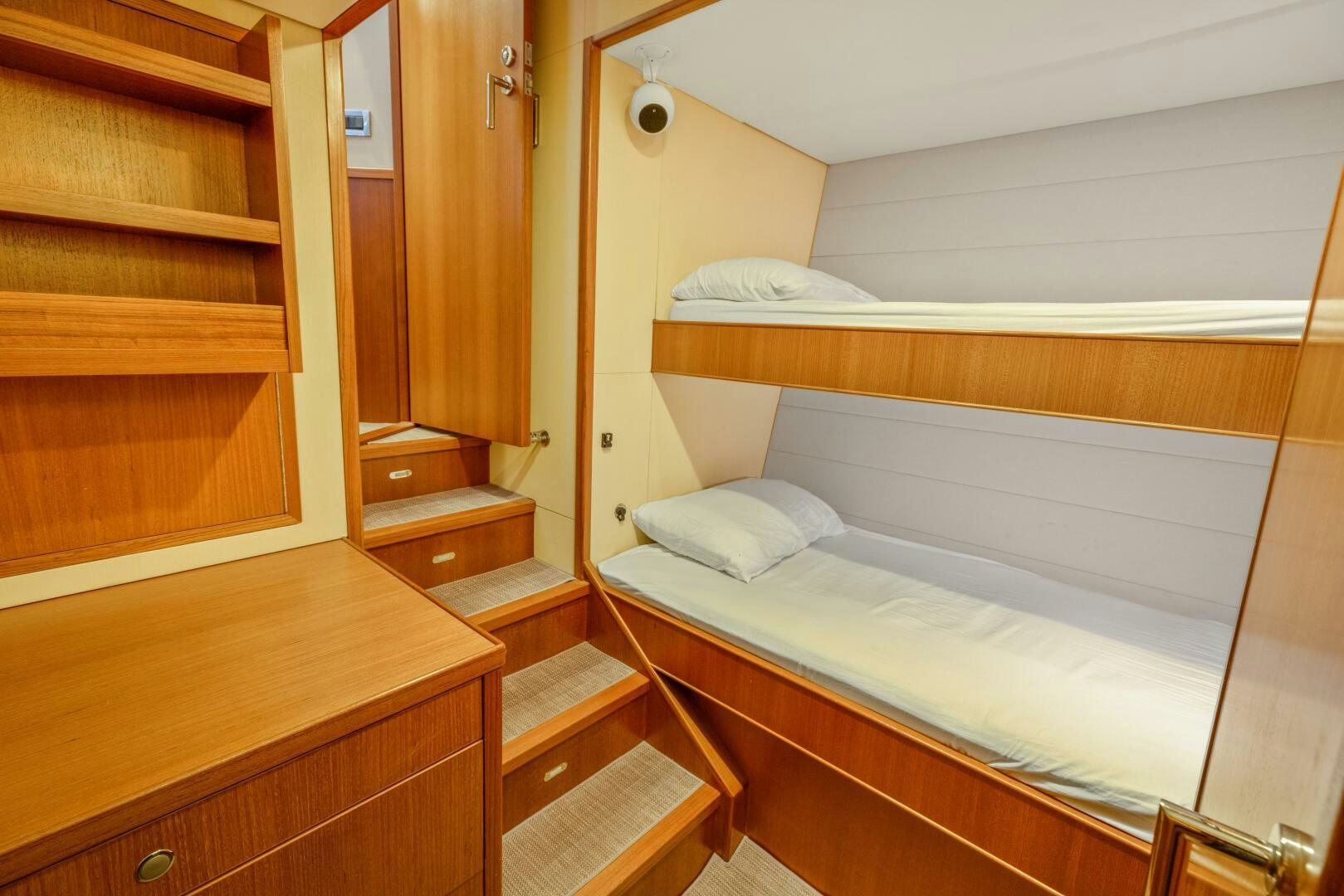 a room with a bed and a shelf aboard SALTY K Yacht for Sale