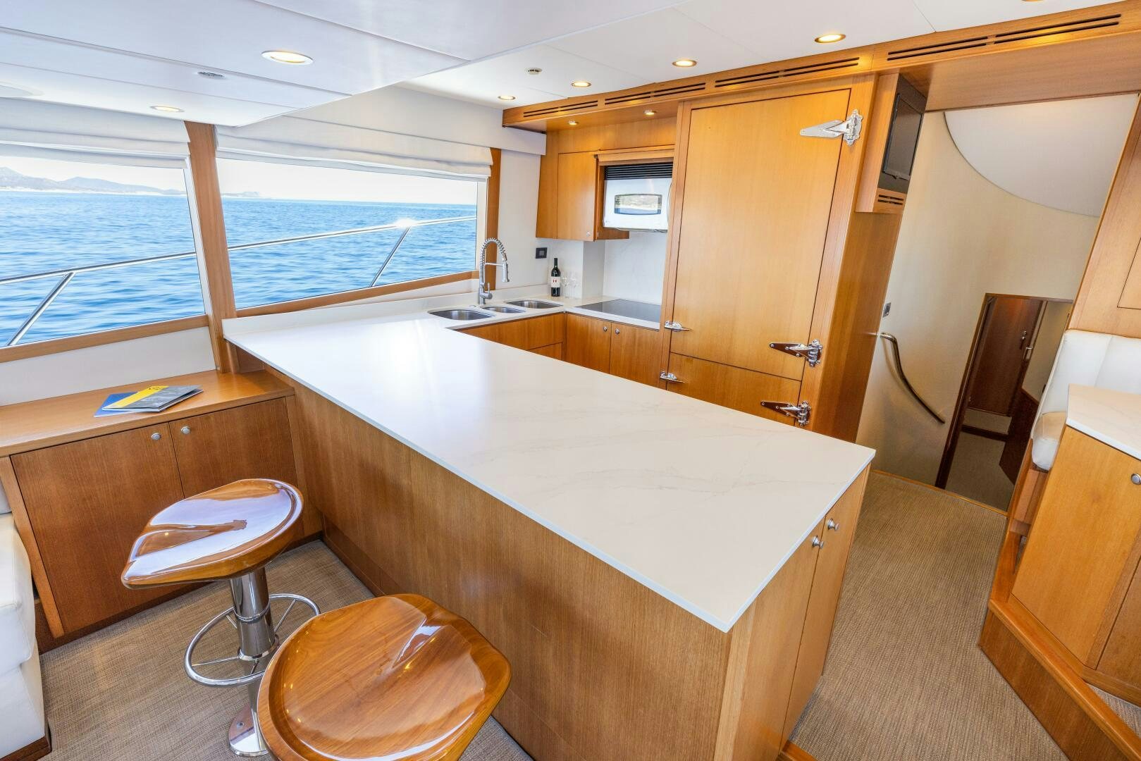 a large kitchen with a large window aboard SALTY K Yacht for Sale
