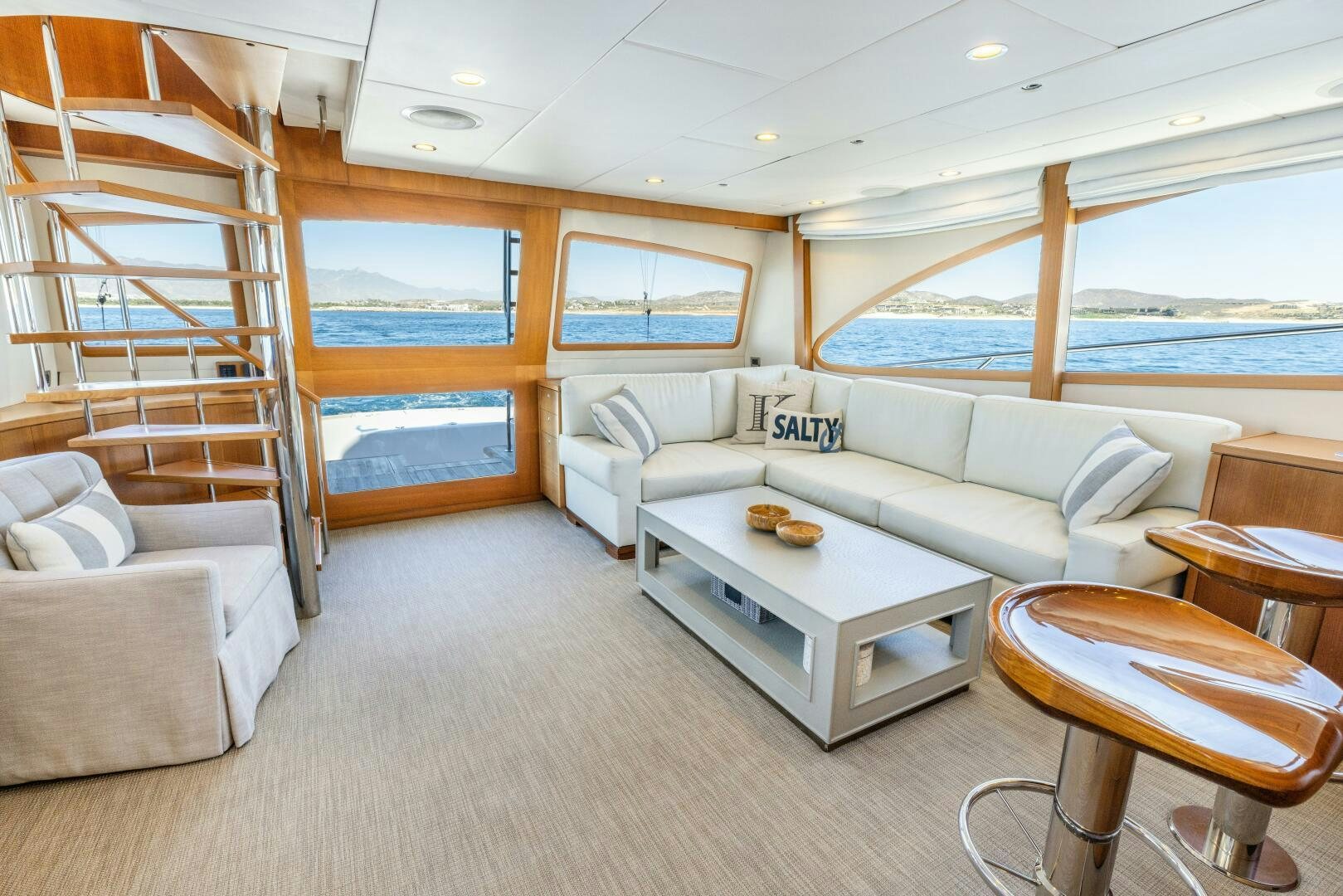 a living room with a large window aboard SALTY K Yacht for Sale
