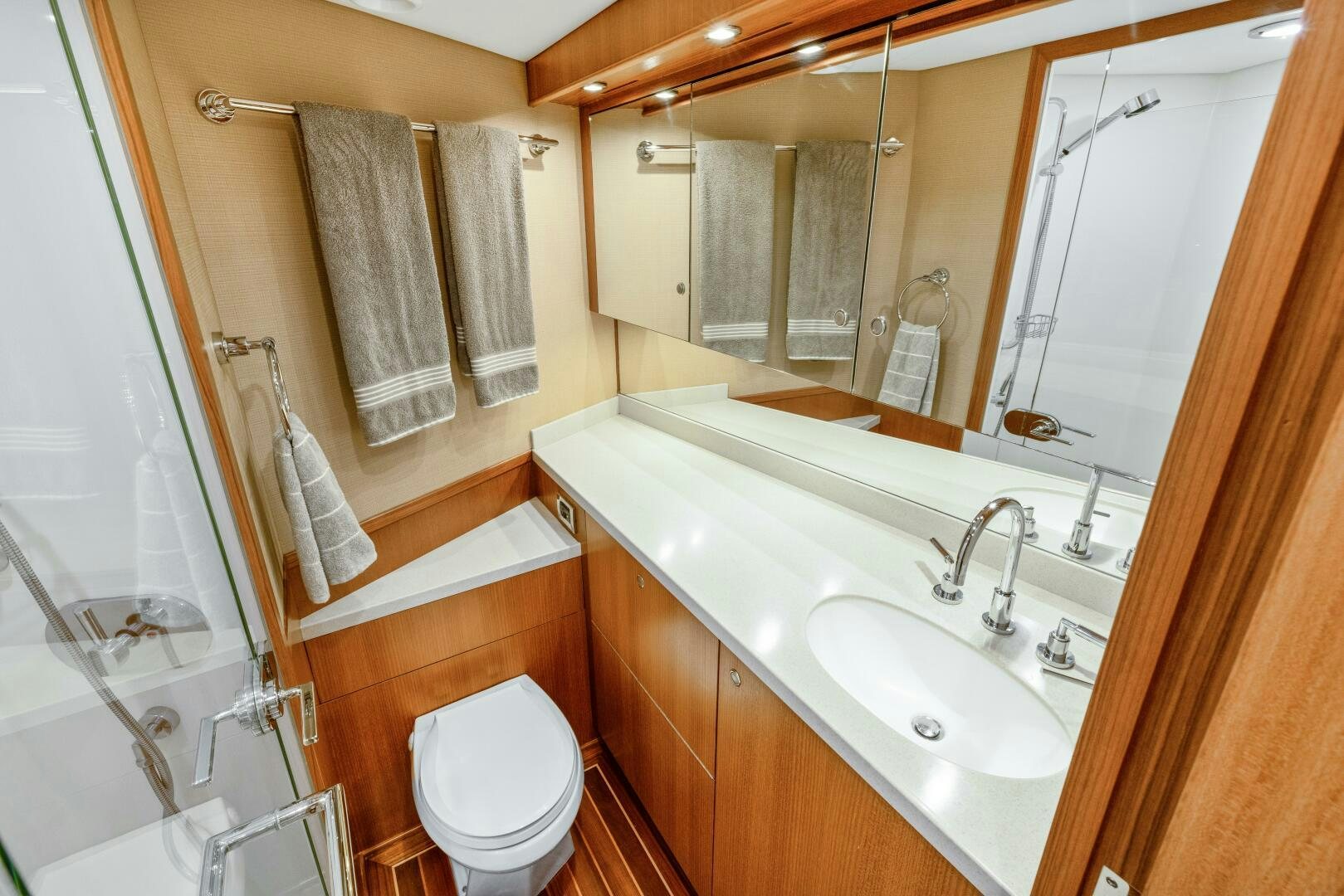 a bathroom with a sink and a toilet aboard SALTY K Yacht for Sale