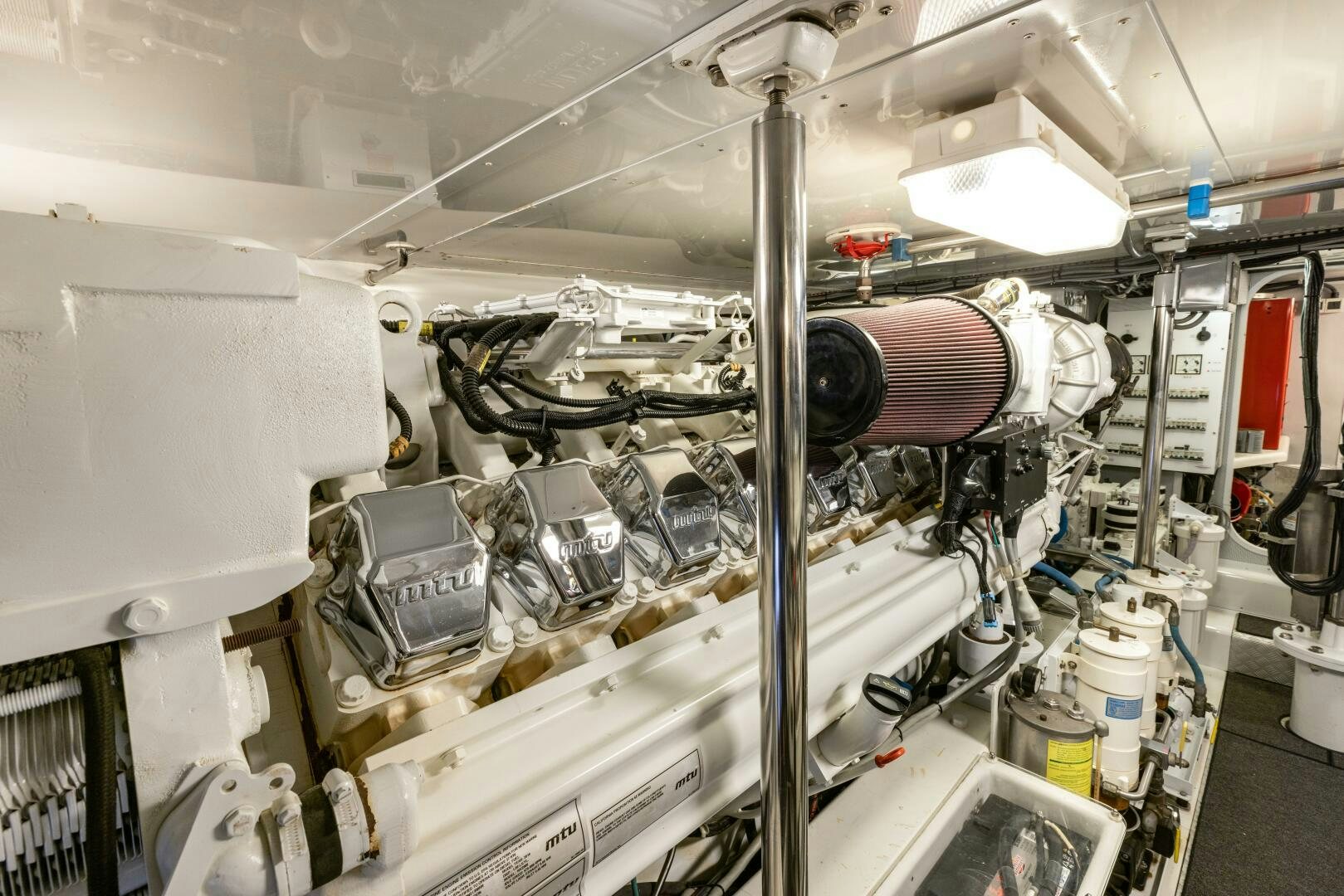 a large white machine with a large metal cylinder aboard SALTY K Yacht for Sale