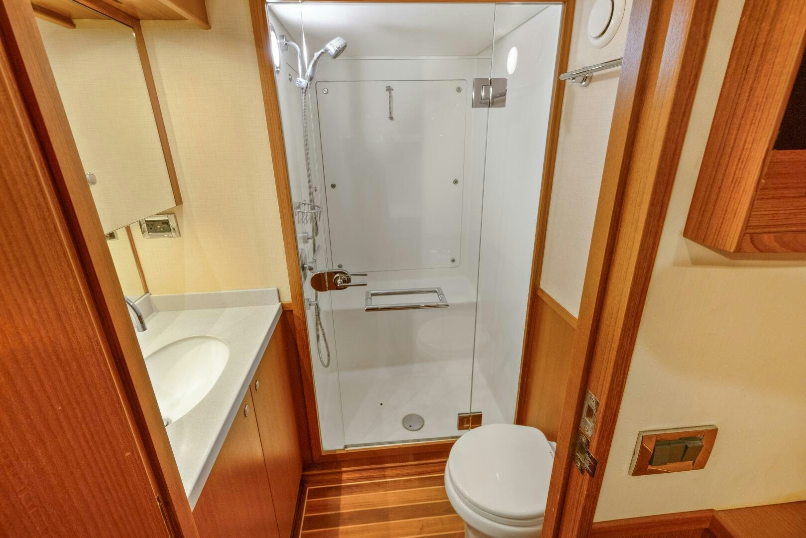 a bathroom with a shower and sink aboard SALTY K Yacht for Sale