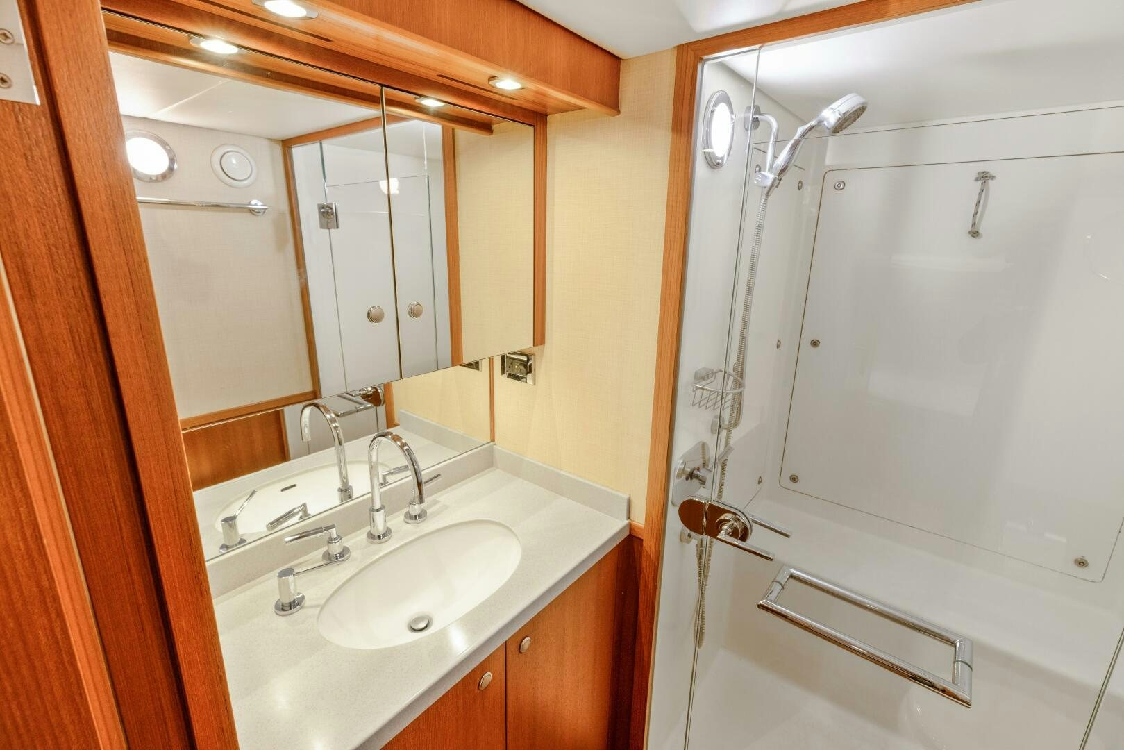 a bathroom with a shower and sink aboard SALTY K Yacht for Sale