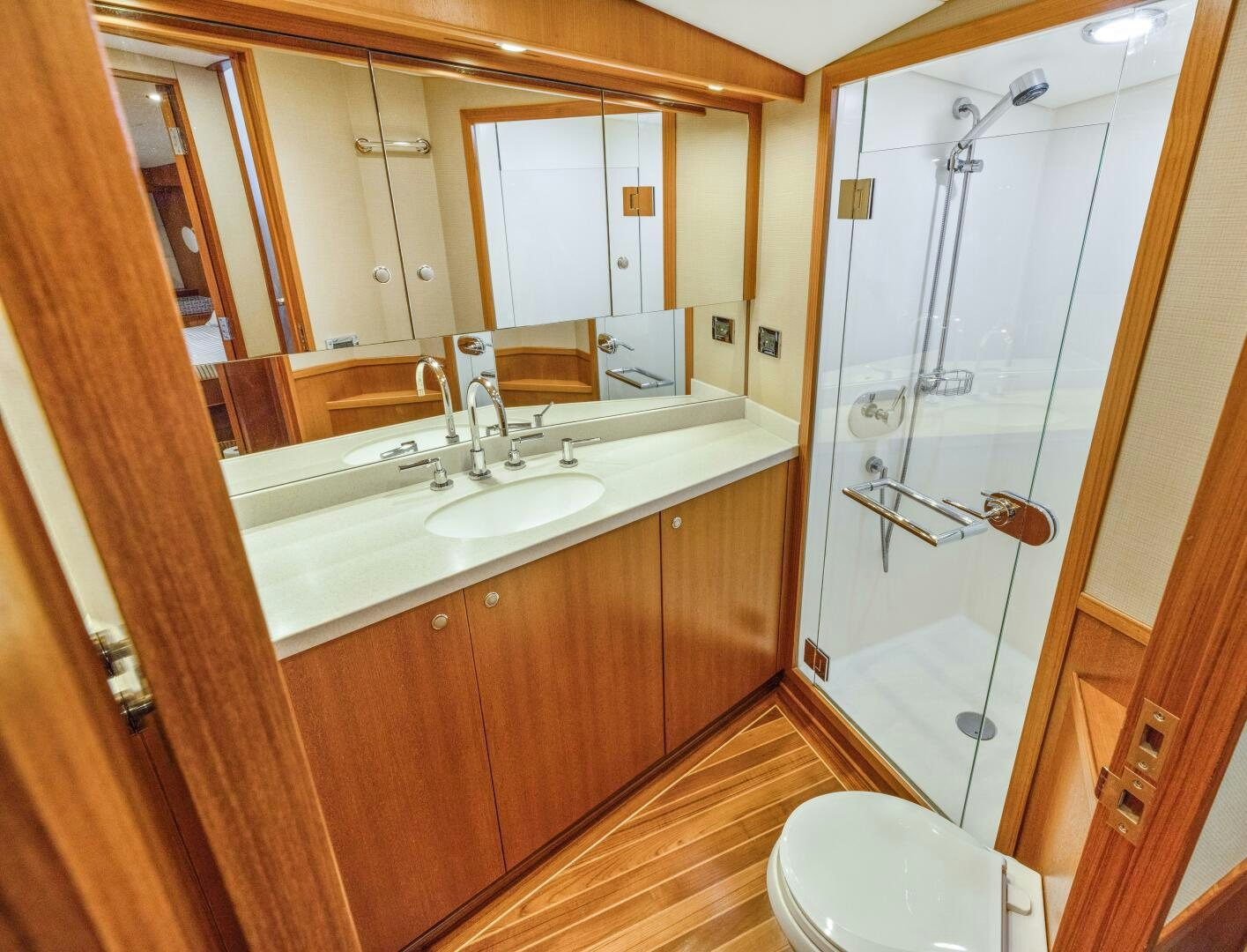 a bathroom with a shower unit and sink aboard SALTY K Yacht for Sale