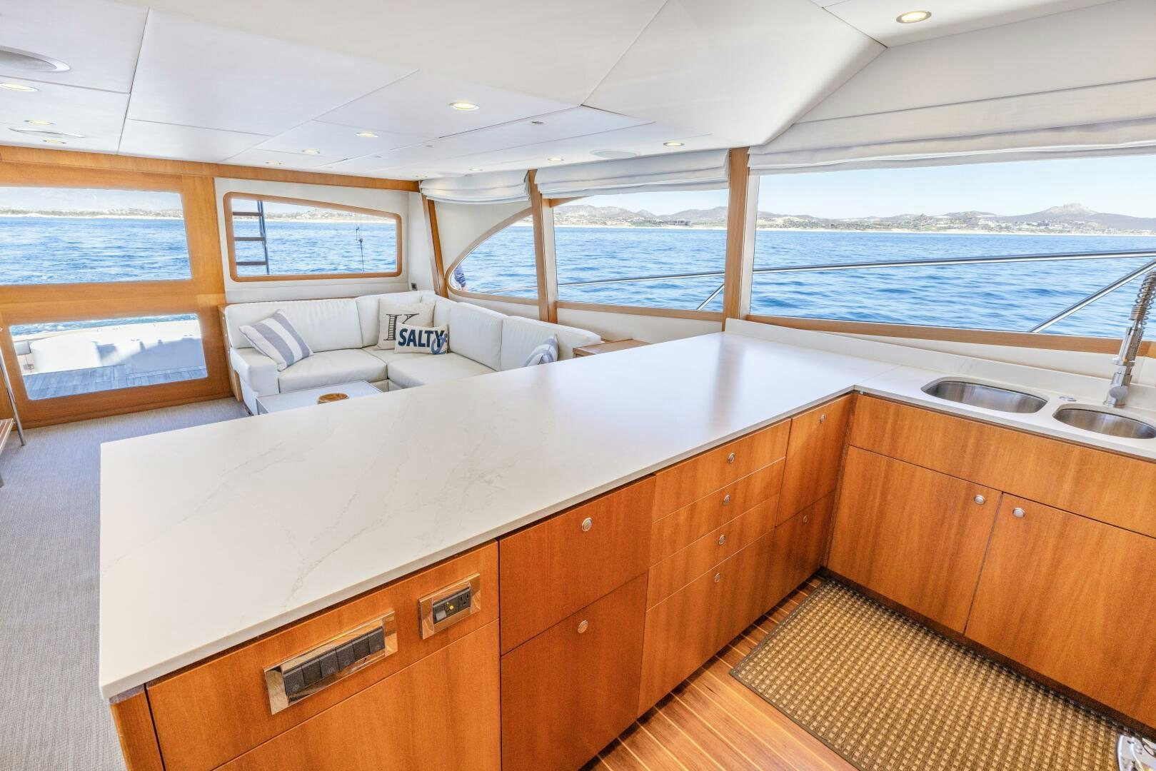 a large bedroom with a large bed aboard SALTY K Yacht for Sale