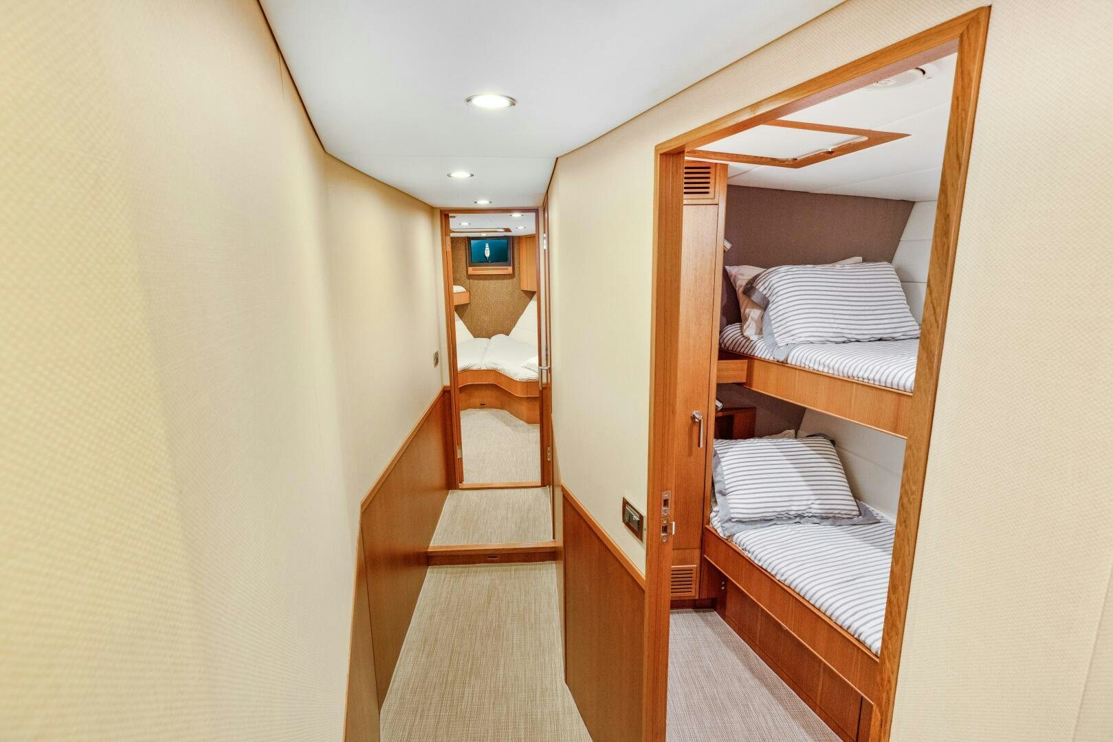 a room with a bed and a closet aboard SALTY K Yacht for Sale