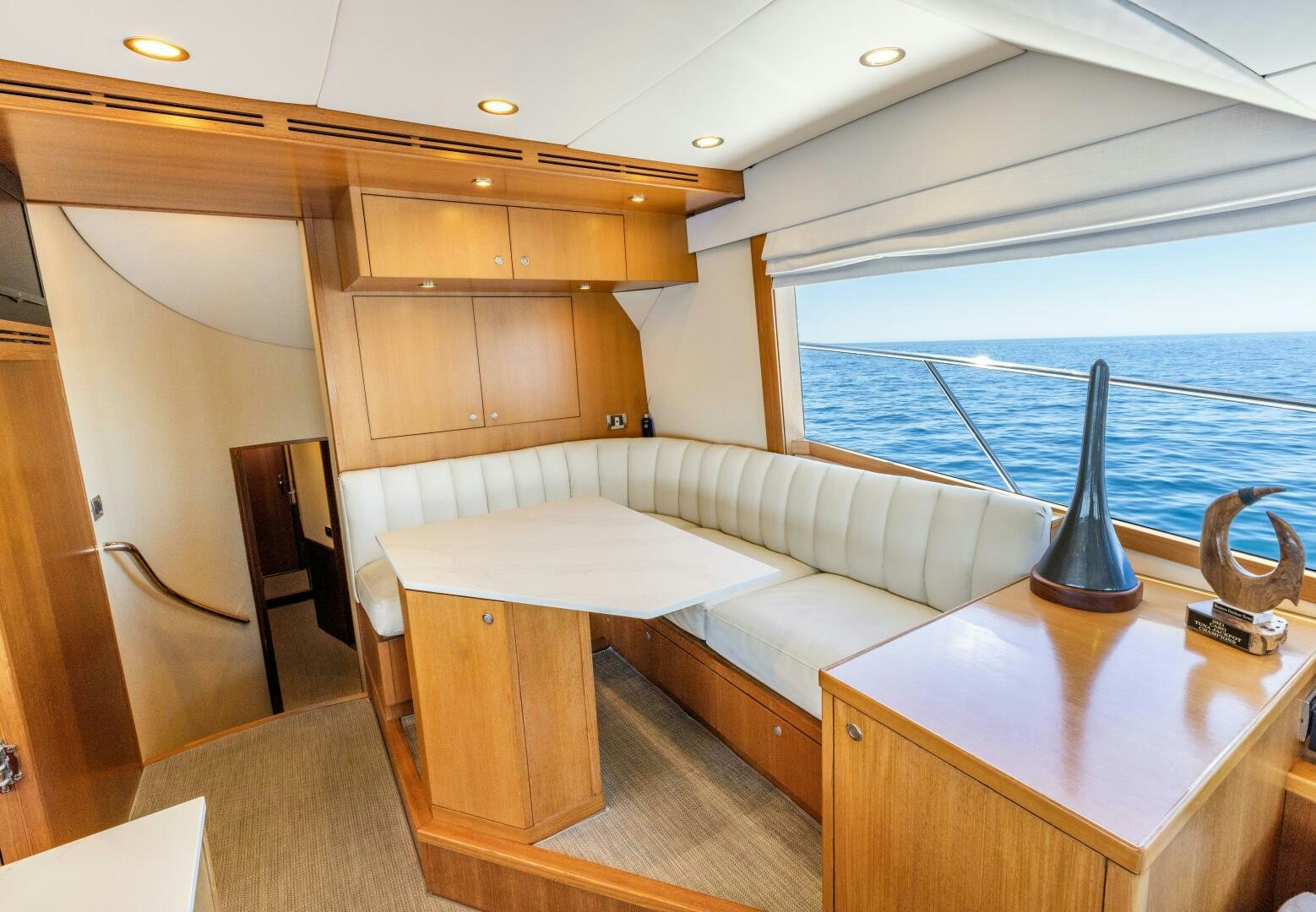 a room with a bed and a table aboard SALTY K Yacht for Sale