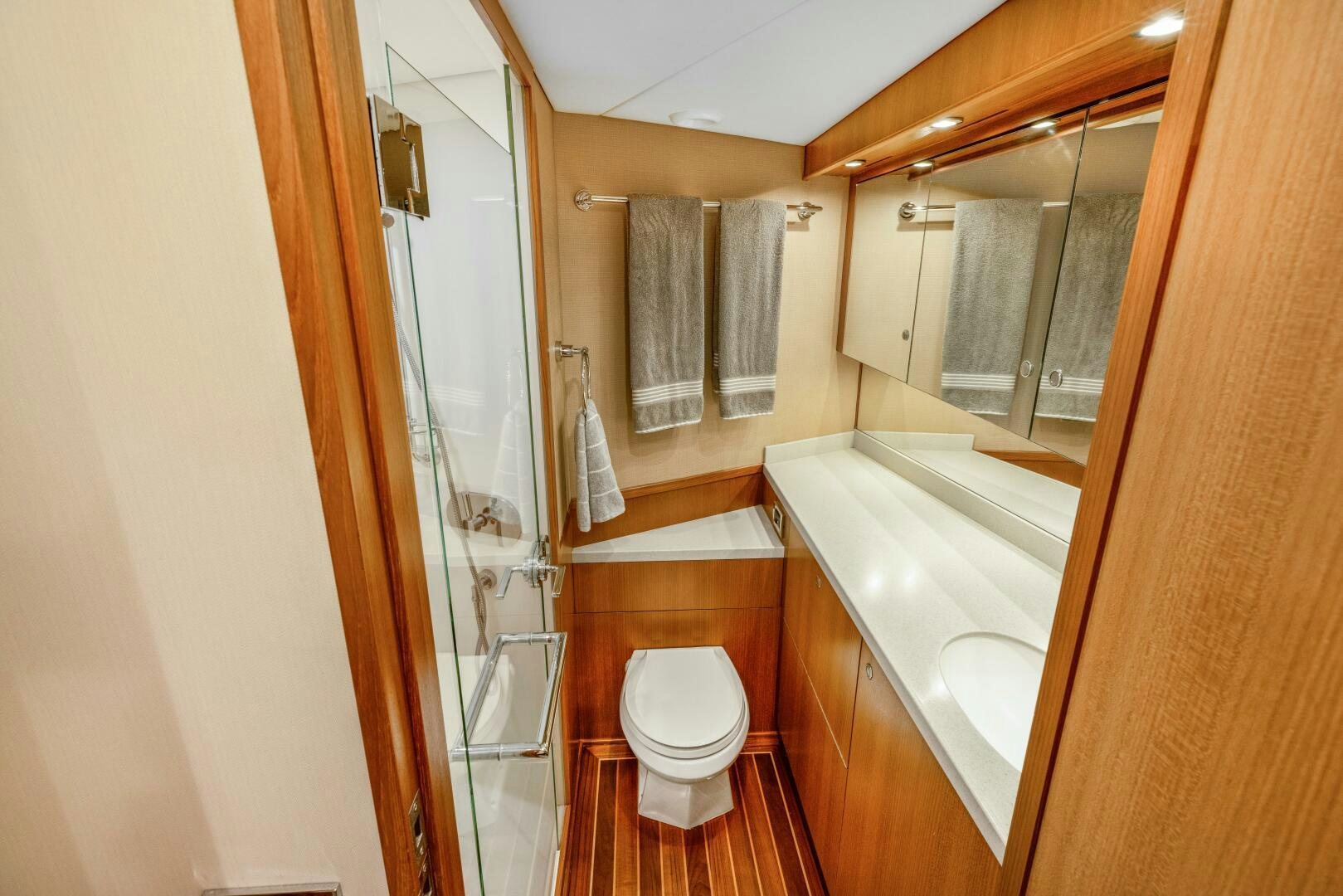 a bathroom with a glass shower aboard SALTY K Yacht for Sale
