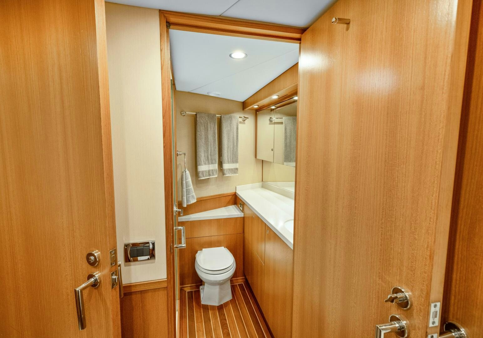 a bathroom with a toilet and a sink aboard SALTY K Yacht for Sale