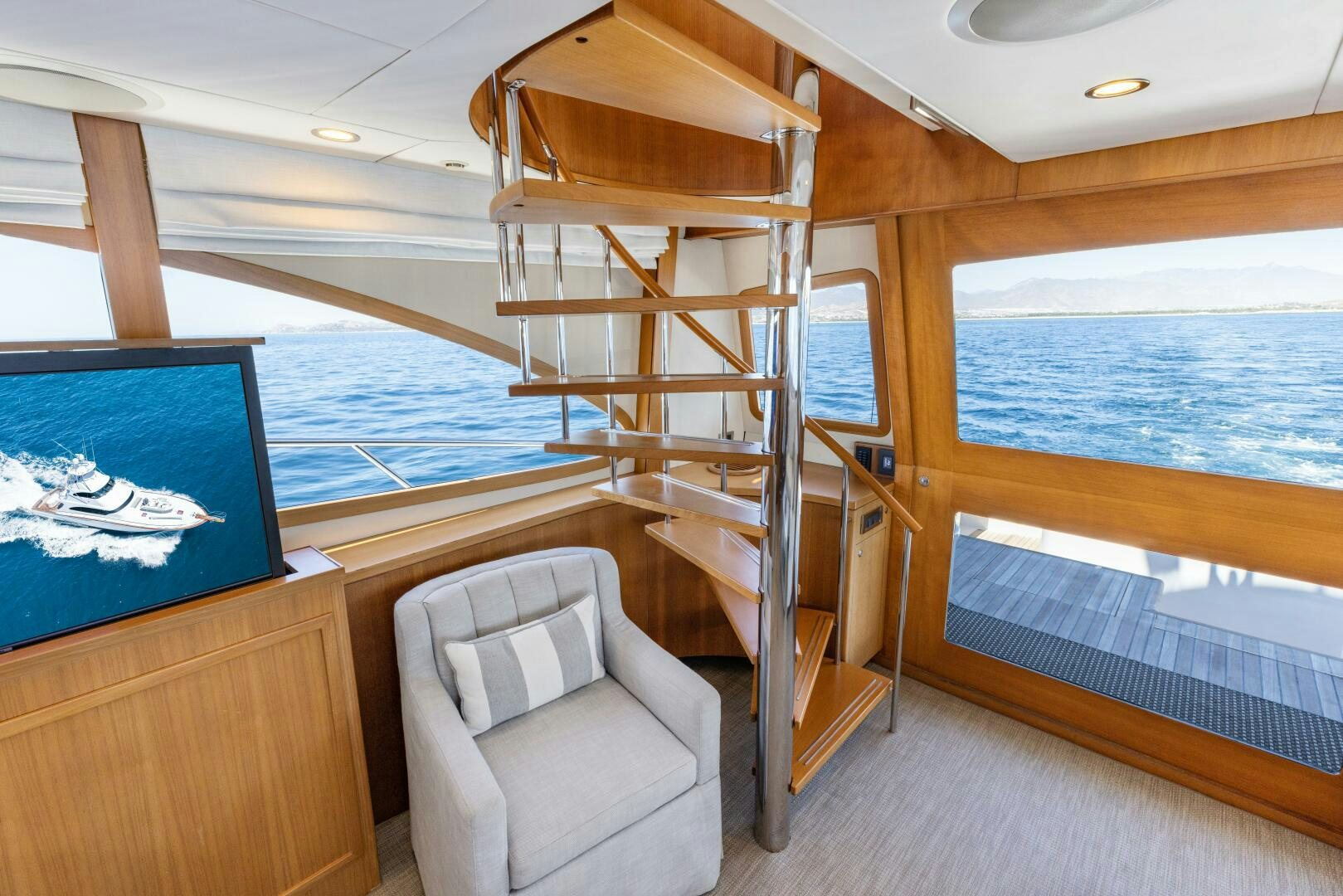 a room with a bed and a chair aboard SALTY K Yacht for Sale