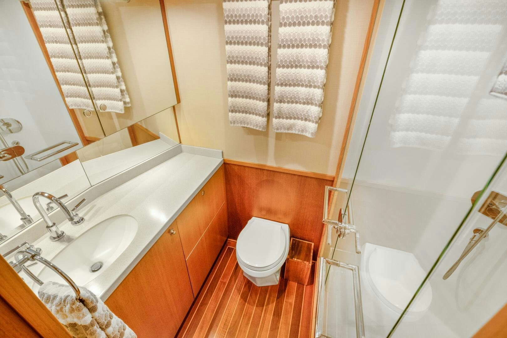 a bathroom with a toilet and sink aboard SALTY K Yacht for Sale