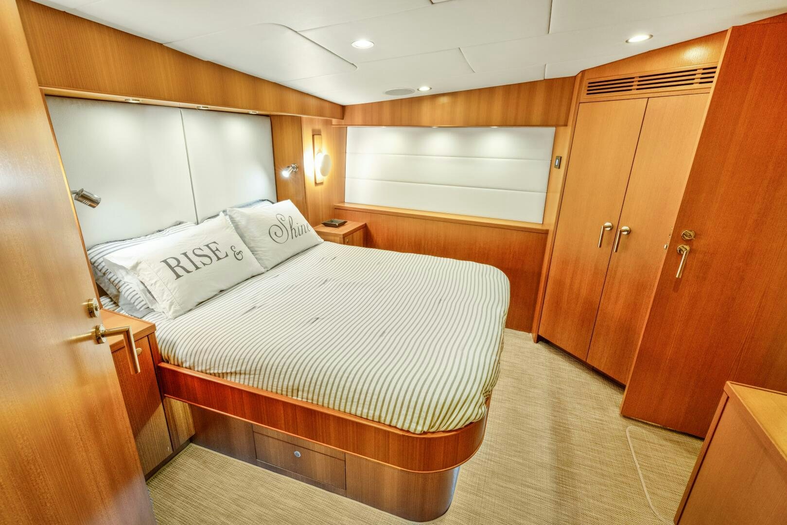 a room with wooden cabinets aboard SALTY K Yacht for Sale