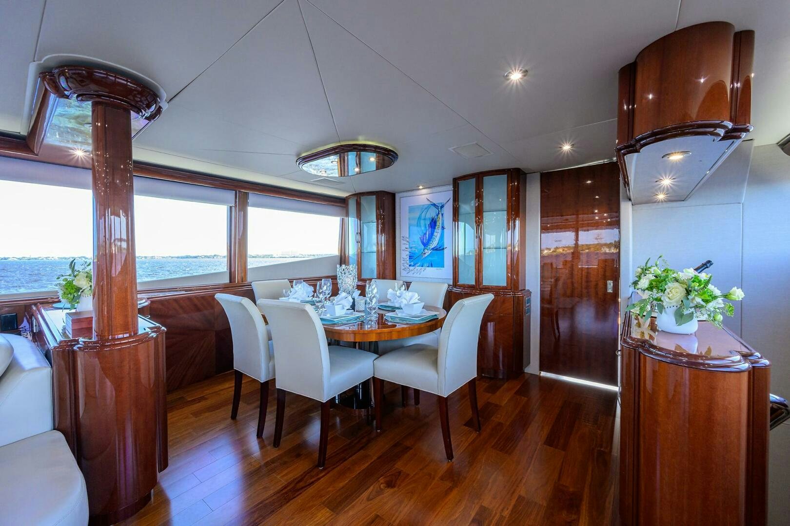 a dining room with a large window aboard ALWAYS BAREFOOT Yacht for Sale