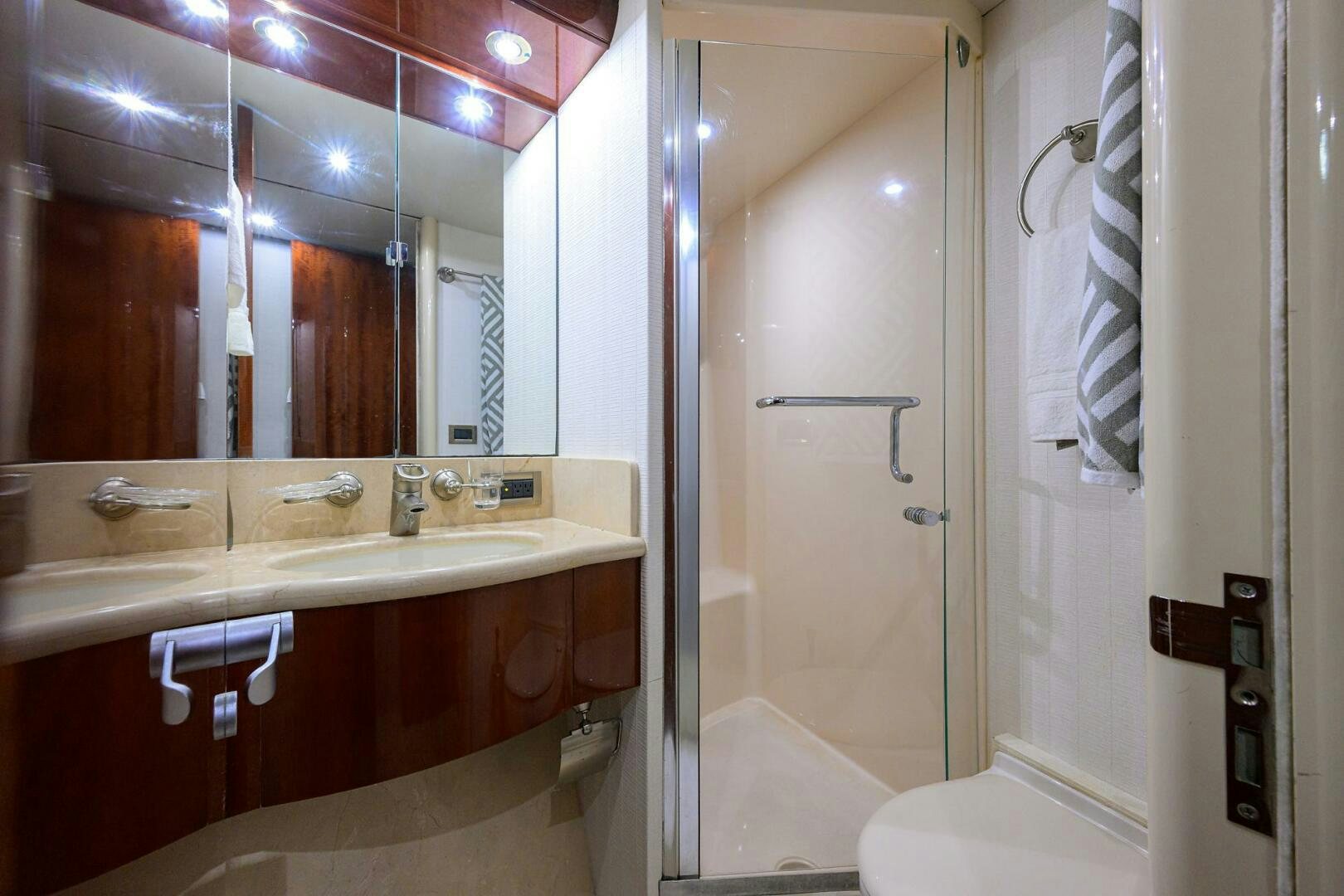 a bathroom with a large mirror aboard ALWAYS BAREFOOT Yacht for Sale