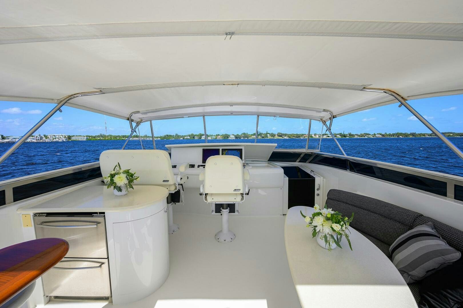 a boat with a table and chairs aboard ALWAYS BAREFOOT Yacht for Sale