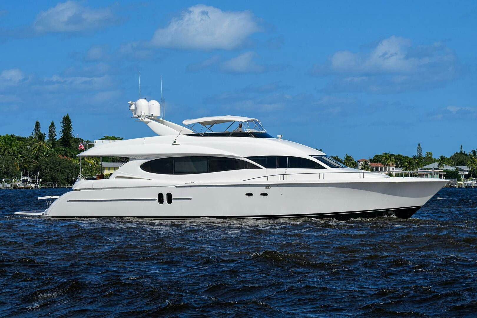 a white yacht on the water aboard ALWAYS BAREFOOT Yacht for Sale