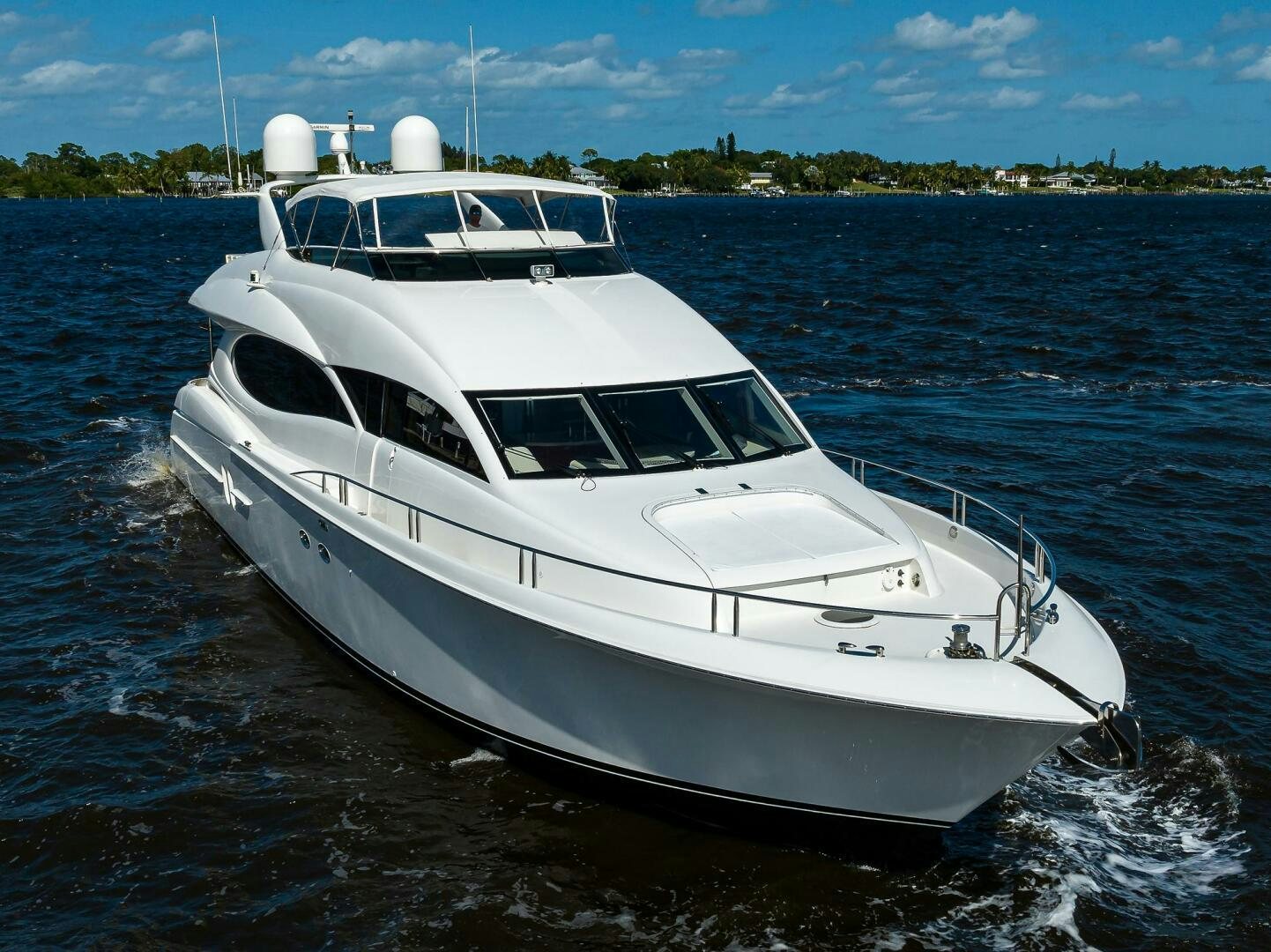a white yacht on the water aboard ALWAYS BAREFOOT Yacht for Sale