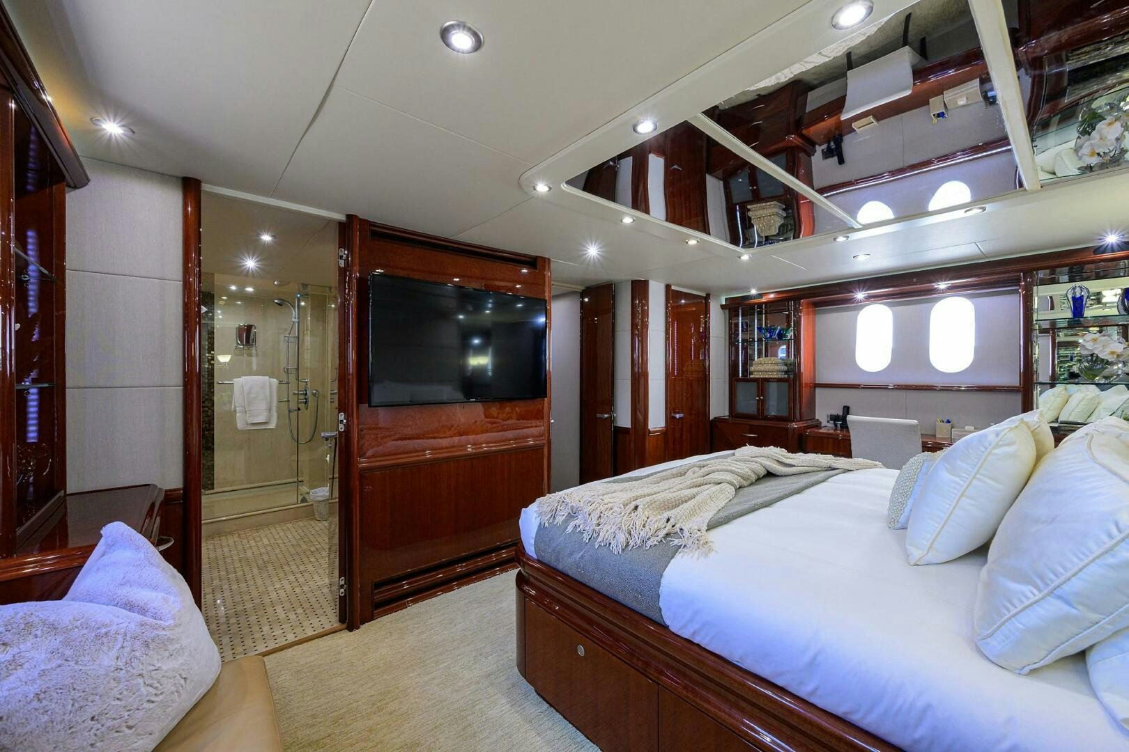 a room with a bed and a television aboard ALWAYS BAREFOOT Yacht for Sale