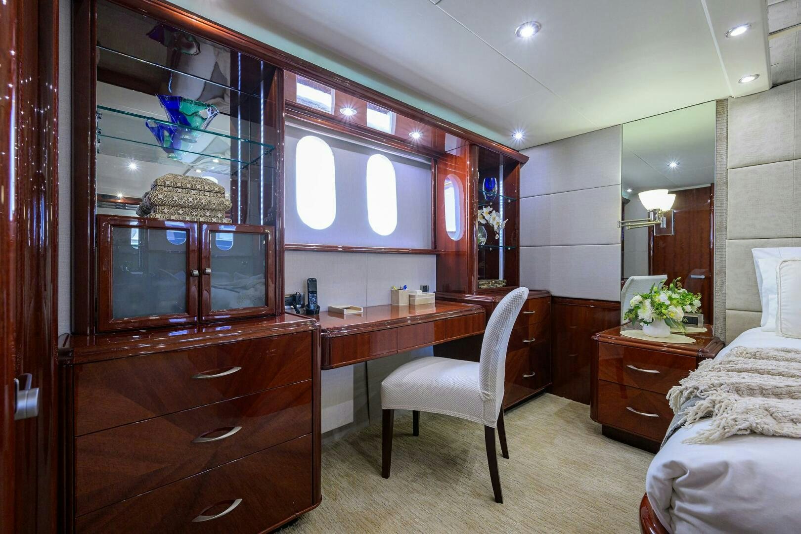 a bedroom with a desk and a bed aboard ALWAYS BAREFOOT Yacht for Sale