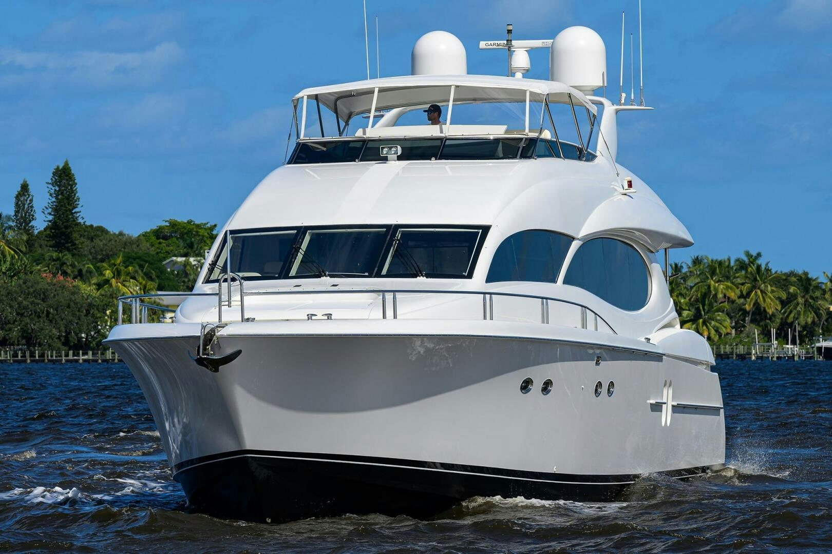 a white yacht on the water aboard ALWAYS BAREFOOT Yacht for Sale