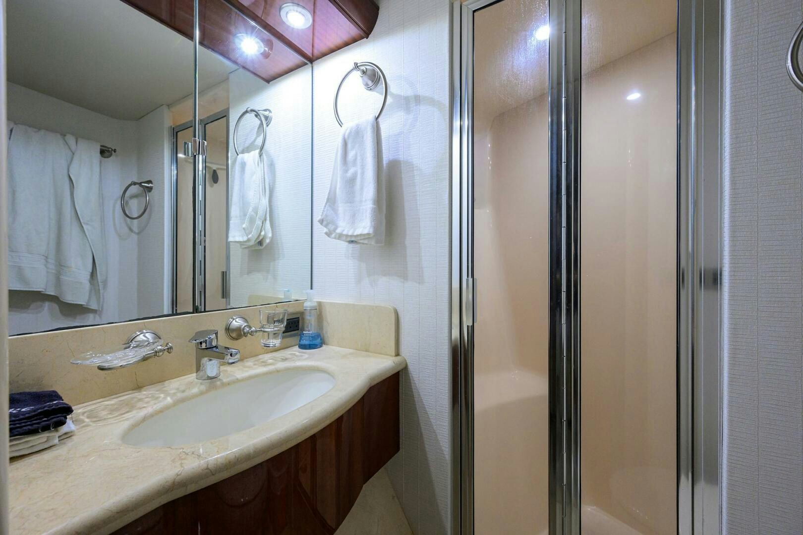 a bathroom with a sink and shower aboard ALWAYS BAREFOOT Yacht for Sale