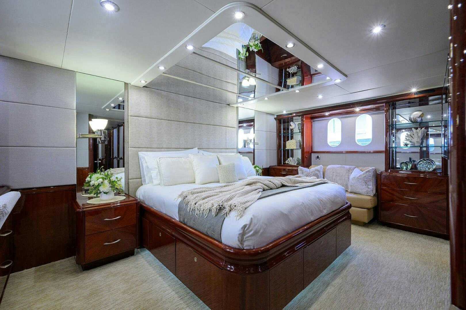 a bedroom with a bed and a mirror aboard ALWAYS BAREFOOT Yacht for Sale