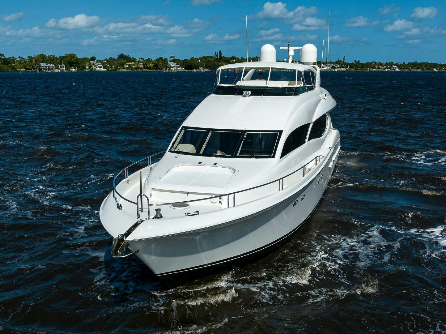 a white boat on the water aboard ALWAYS BAREFOOT Yacht for Sale