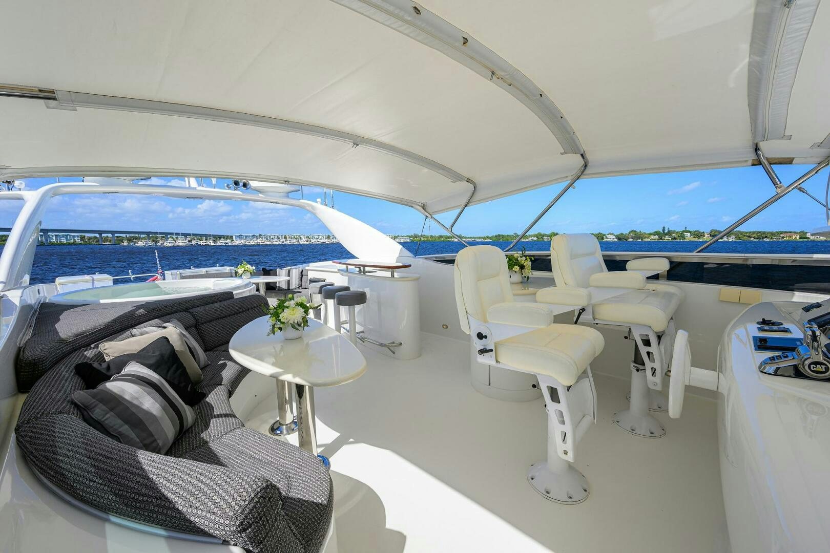 a lounge area with chairs and tables aboard ALWAYS BAREFOOT Yacht for Sale