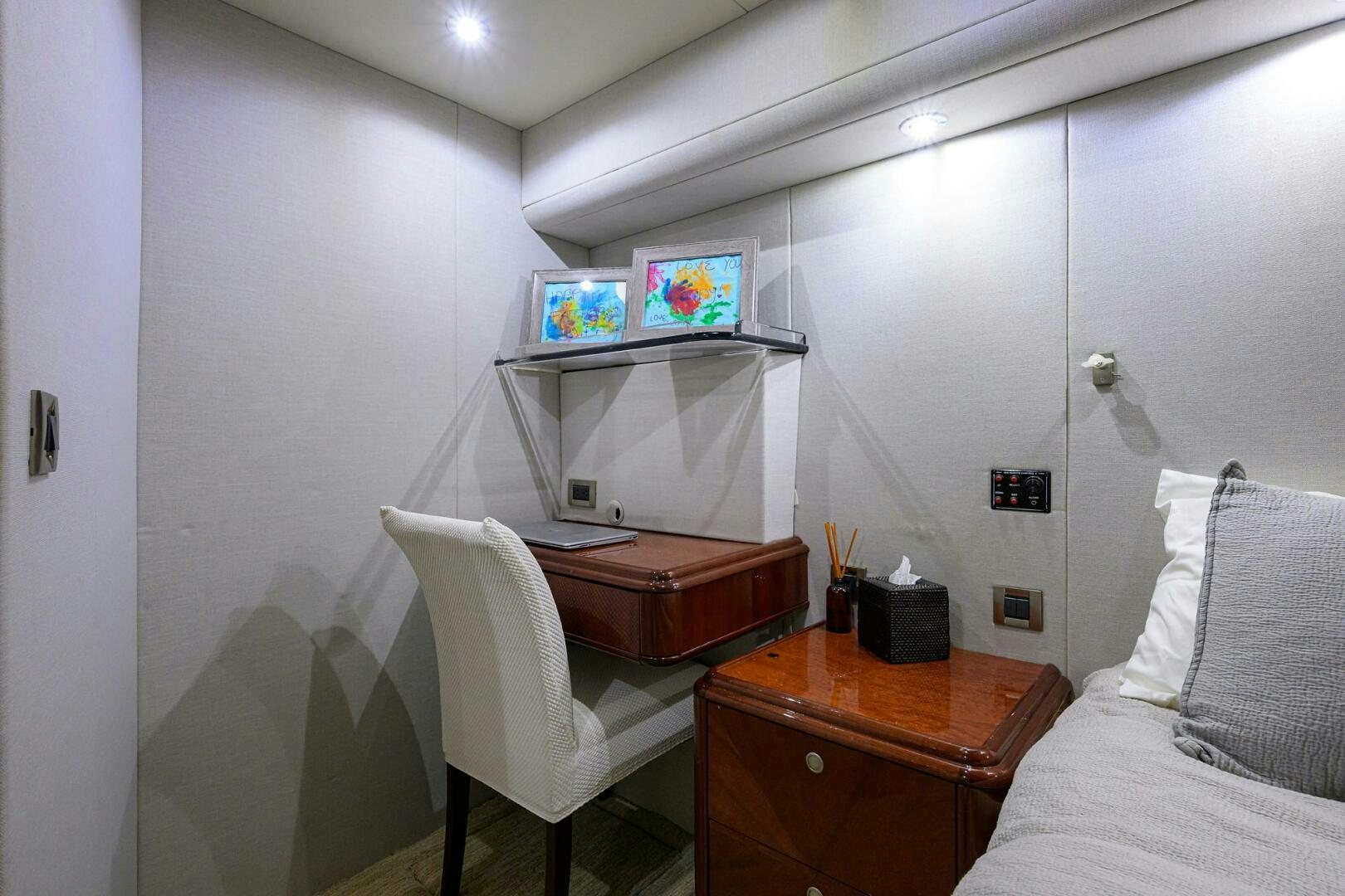 a small bedroom with a desk and a bed aboard ALWAYS BAREFOOT Yacht for Sale