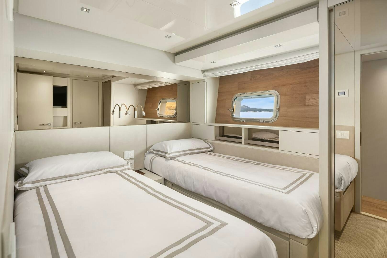 a room with three beds aboard SANLORENZO SL86 Yacht for Sale