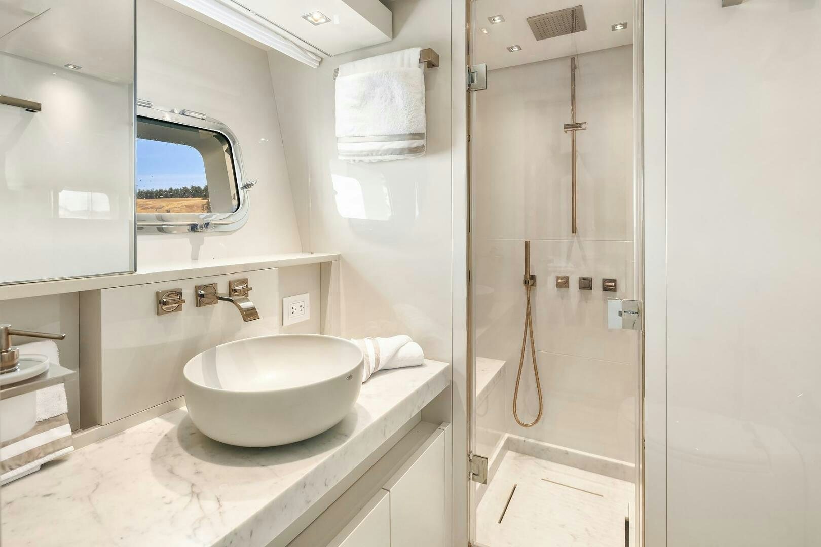 a bathroom with a sink and a shower aboard SANLORENZO SL86 Yacht for Sale
