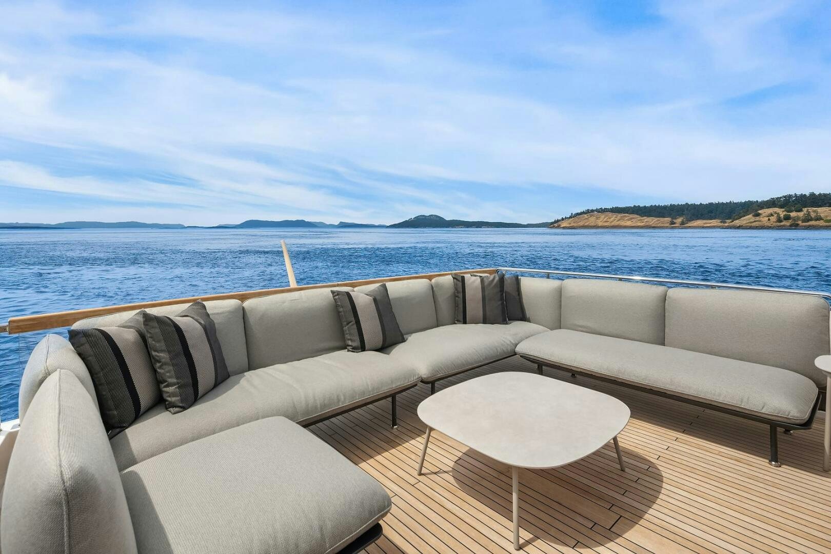 a couch and a table on a boat aboard SANLORENZO SL86 Yacht for Sale