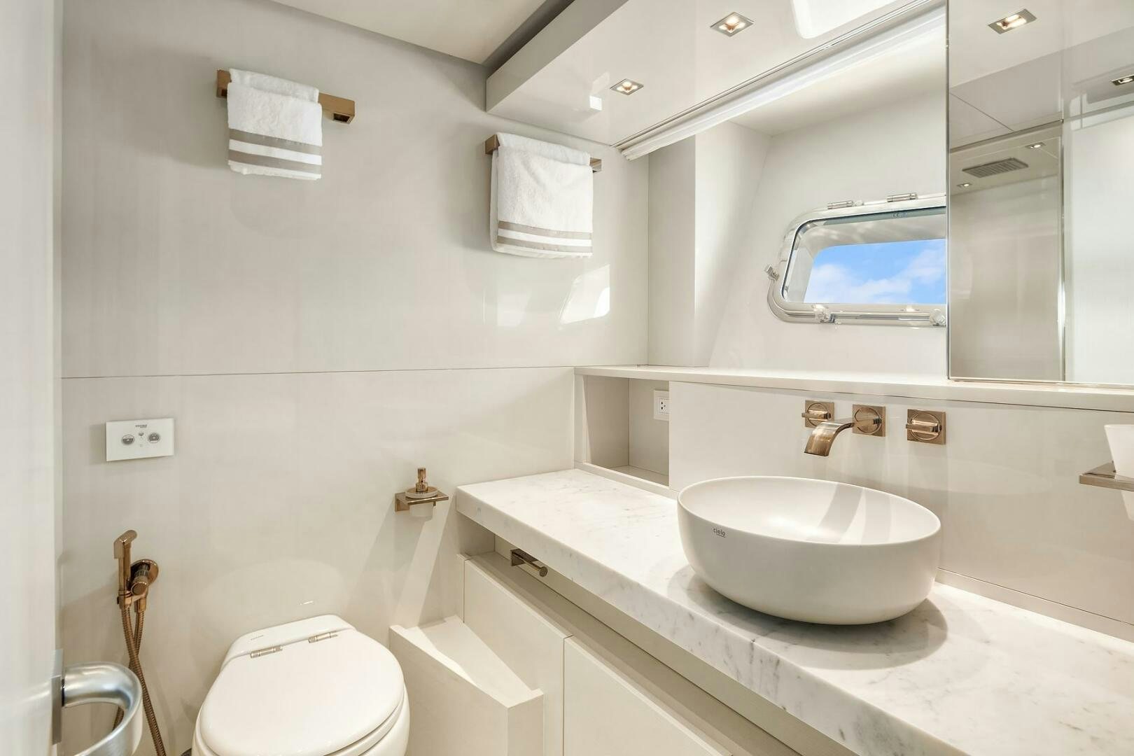 a bathroom with a sink and a toilet aboard SANLORENZO SL86 Yacht for Sale