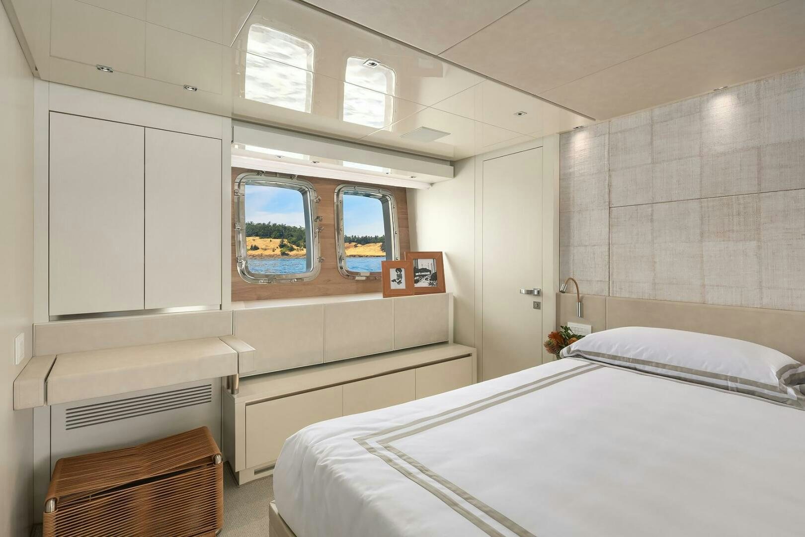 a room with a bed and a window aboard SANLORENZO SL86 Yacht for Sale