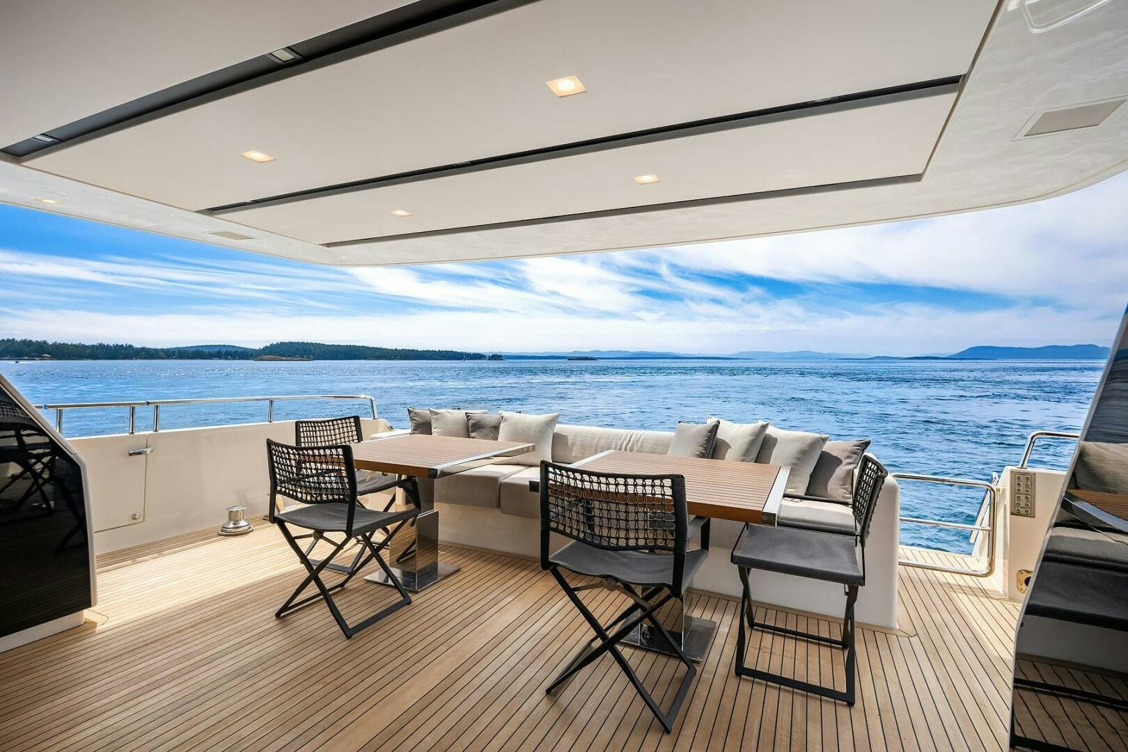 a room with a table and chairs aboard SANLORENZO SL86 Yacht for Sale